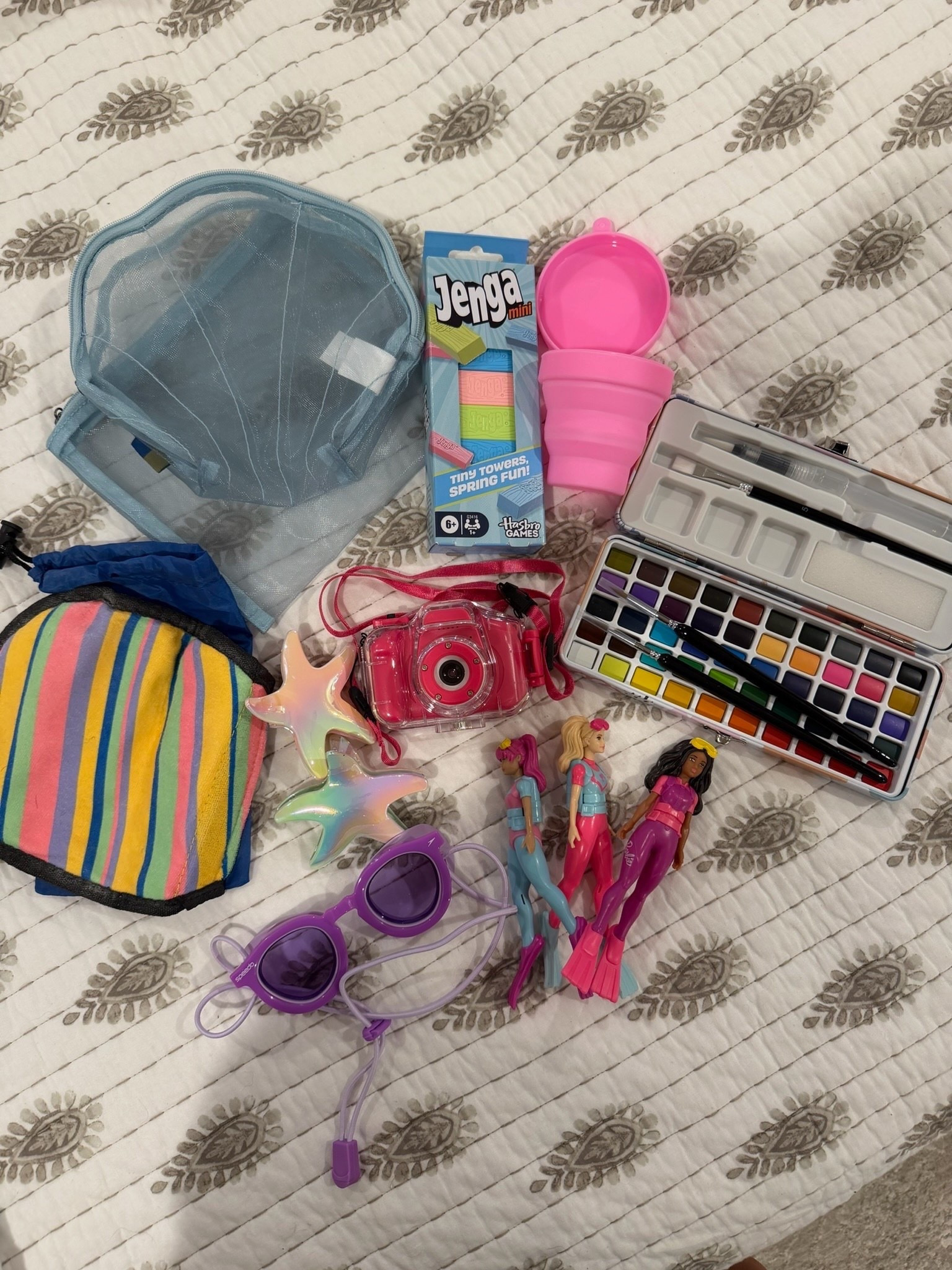 Alexandria’s must haves to keep her entertained and having fun! 



Summer 2026, summer, hair clip, Jenga, mesh pouch, silicone travel cup, watercolor, waterproof camera, Barbie, mom life, Carla.bushey