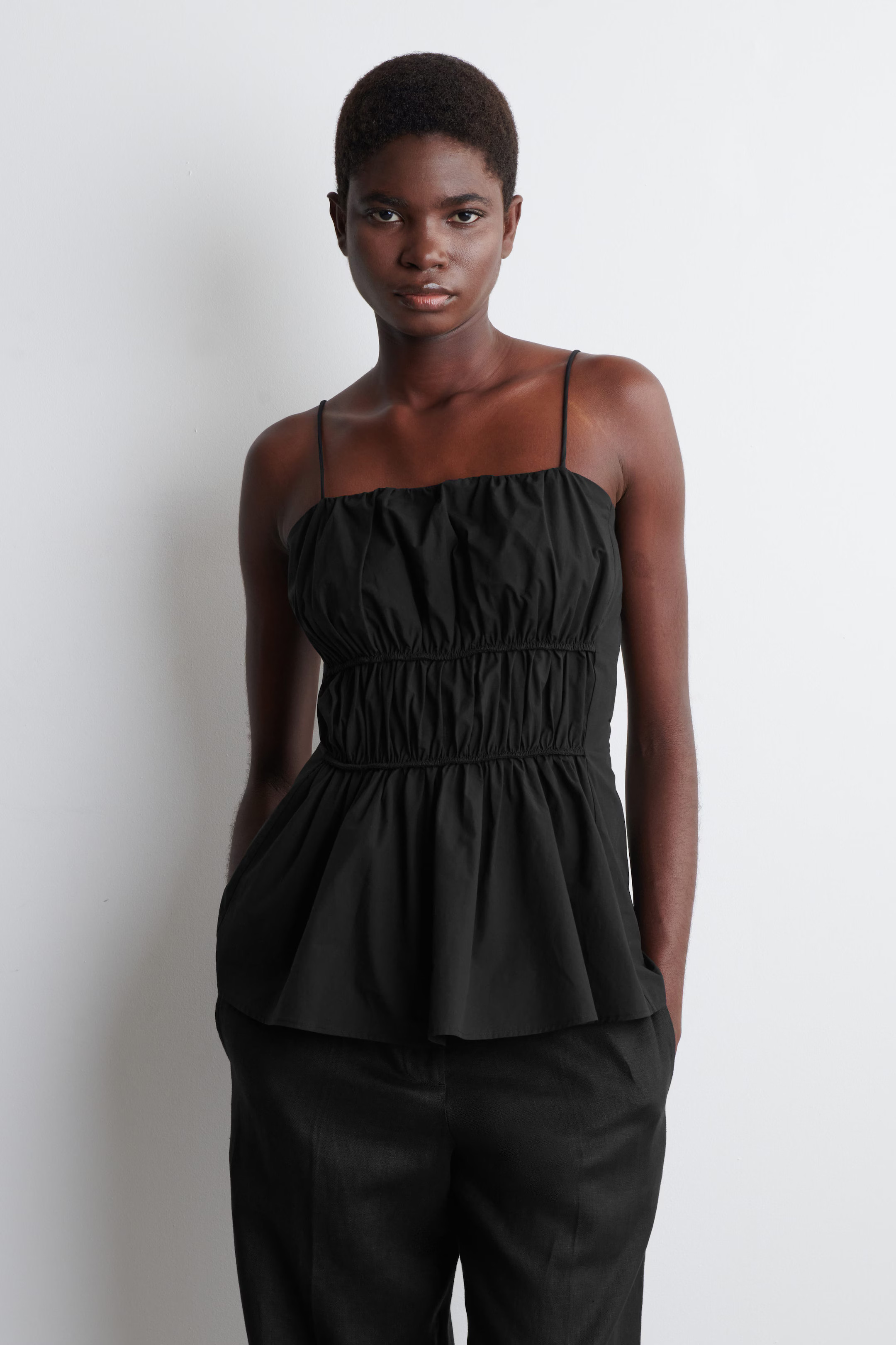 GATHERED COTTON PEPLUM TOP - BLACK | COS | COS UK