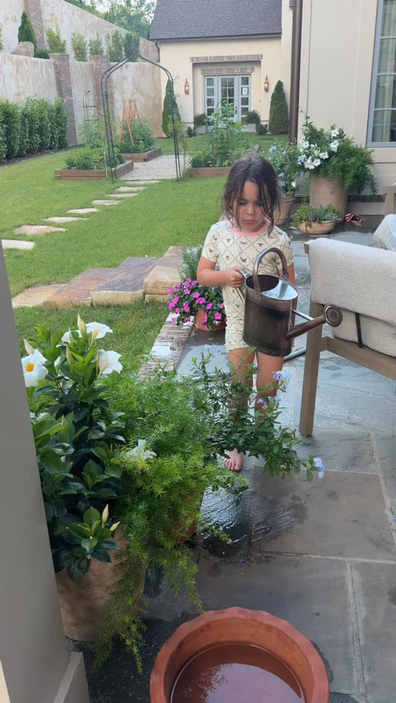 Ellie watering my plants! 

outdoors l watering can  

 