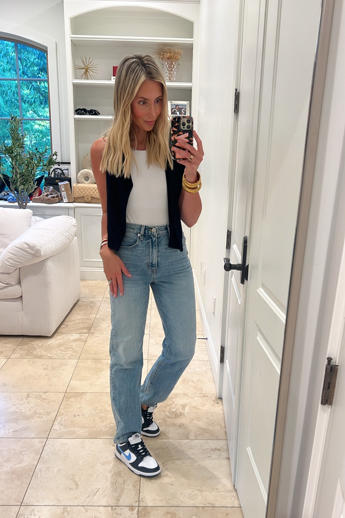 The best white tank and high waisted jeans. 

#LTKSaleAlert