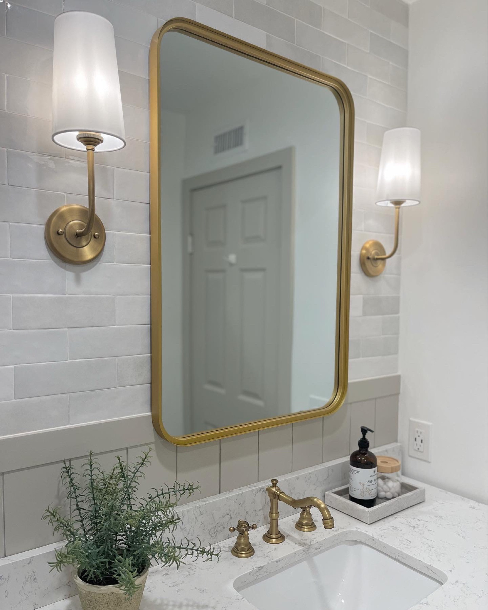 Bathroom Design 

Shiplap, tiled walls, sconces, brass accents 

#LTKhome