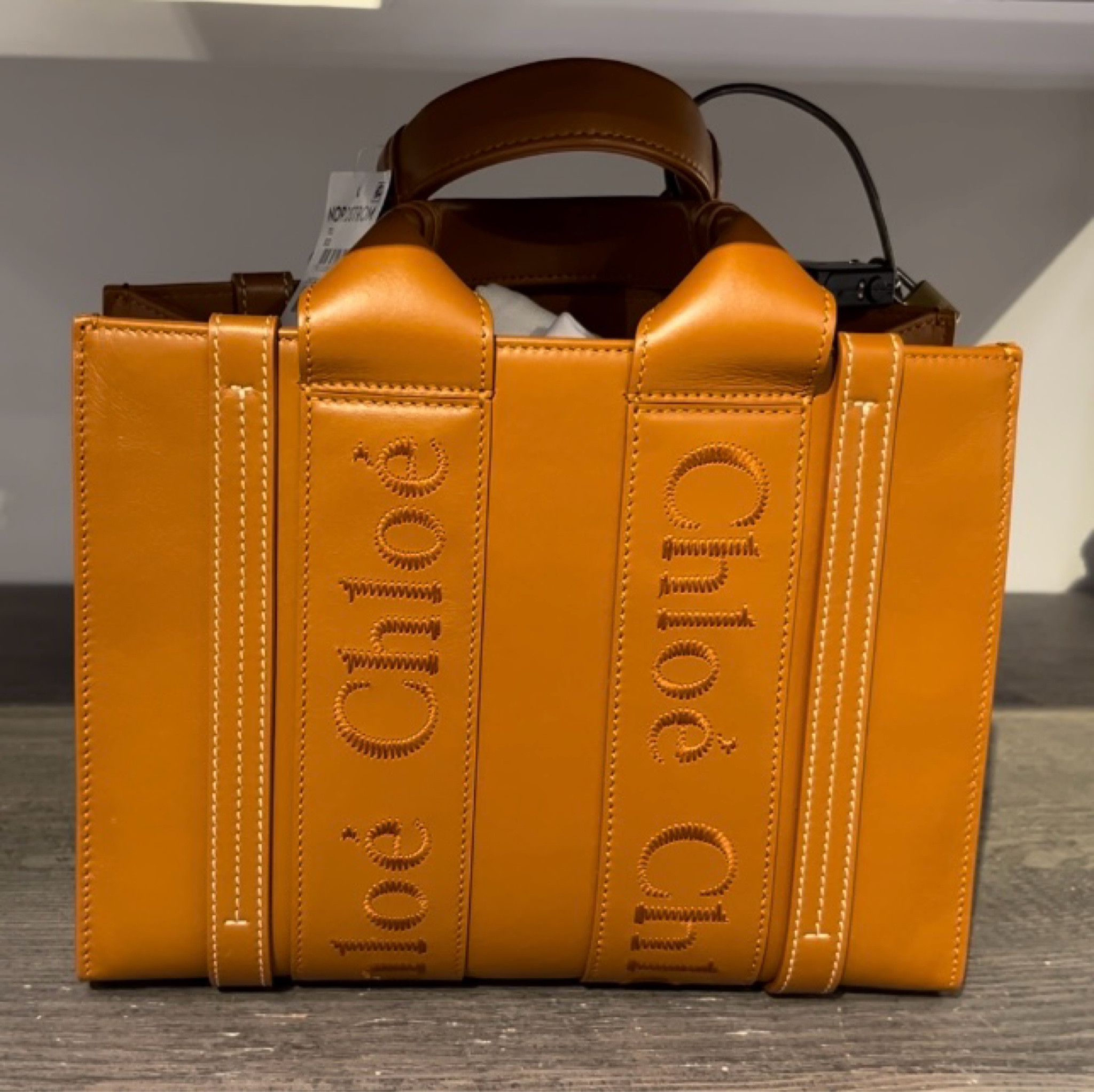 Seeing this Chloe bag in person was a game changer. It might be on the wish list. It is so cute. The leather is such high-quality and such a beautiful yellowy cognac color. It’s a good bag y’all. Small woody tote.

#LTKOver40 #LTKStyleTip #LTKItBag