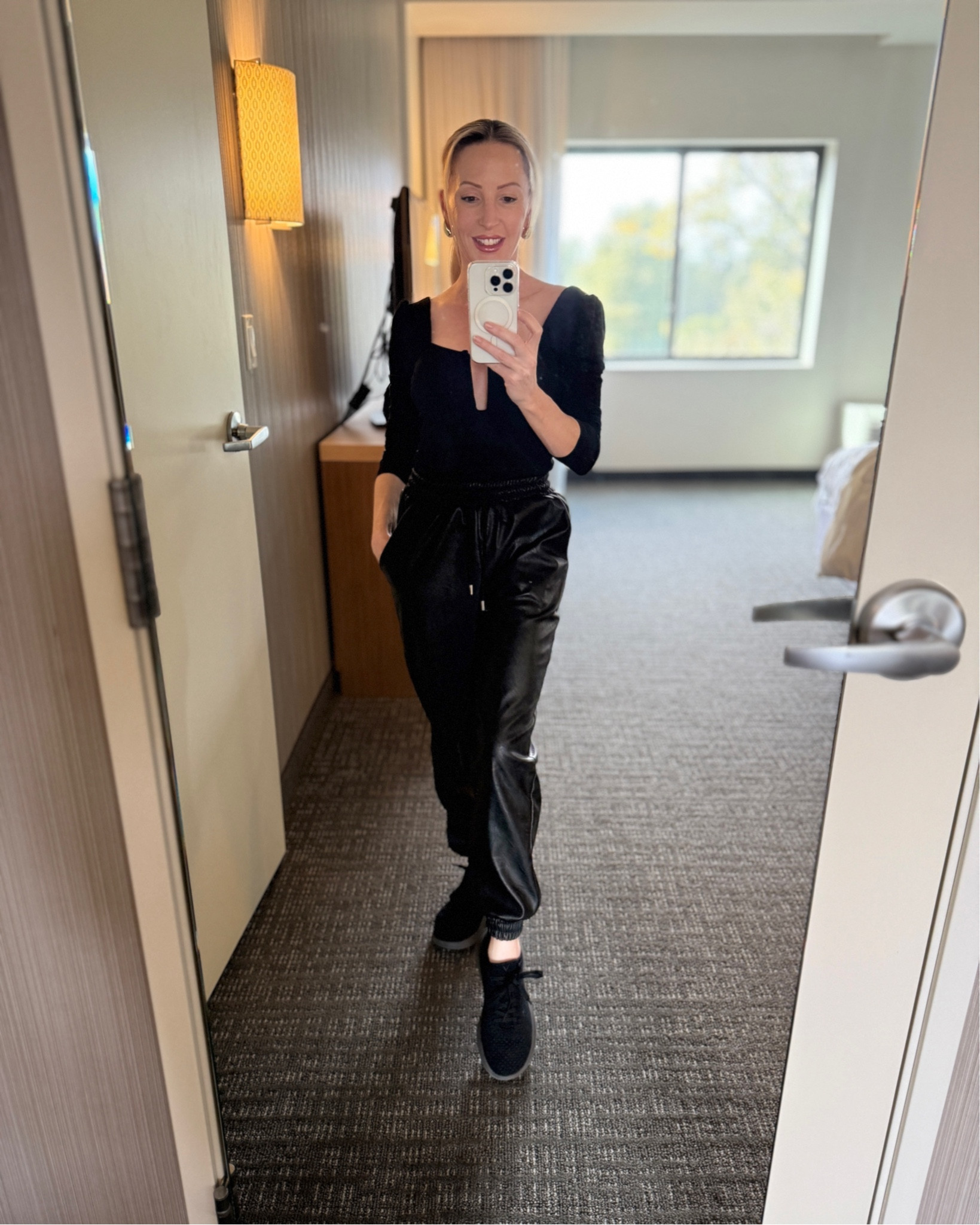 Comfortable and casual Fall outfit : black leather joggers. I tend to go for cuffed joggers so they don’t trail on the floor and get wet and dirty as a petite. Sexy plunging black top to elevate the sweats and black sneakers. PS the sneakers are laced slip ons which saves time and your nails, they don’t need to be worn with socks and are machine washable. It also makes a cute and comfy airport outfit / travel outfit that’s easy to layer with blazers, cardigans, sweaters, zip up sweaters and jackets.

#LTKFindsUnder100 #LTKStyleTip #LTKTravel