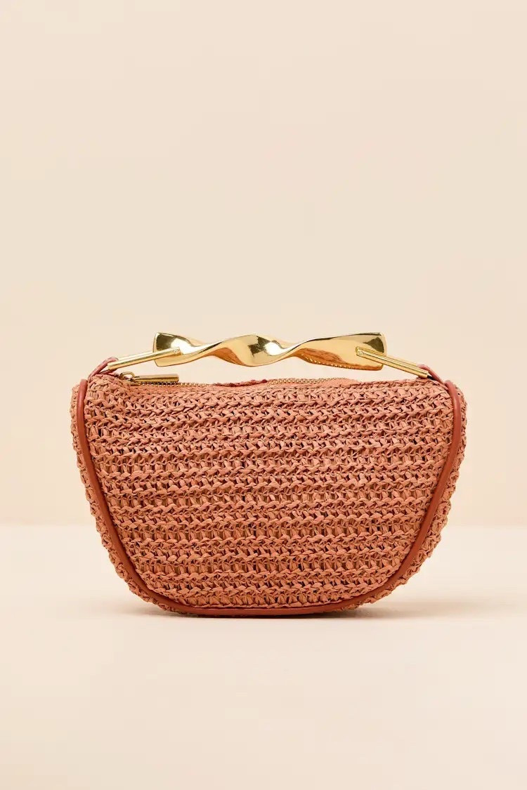 This beachy and chic handbag is the ideal summer companion, spacious enough for all your sunny day accessories yet effortlessly stylish. The woven raffia silhouette features a zipper top, a twisted top handle, and an internal sidewall pocket, offering a way to keep things organized. Attach the adjustable crossbody strap for a hands-free look. ON SALE and under $40.

Keywords: Beach bag, woven tote bag, crossbody bag, spring outfit accessories, spring outfit handbags, straw bag, mini tote bag, faux leather bag, beach vacation bag, spring break, spring break outfits, resort outfits women, beach bag, beach handbag, day date, date night outfits, summer vacation, summer handbags 

#LTKSaleAlert #LTKSeasonal #LTKTravel
