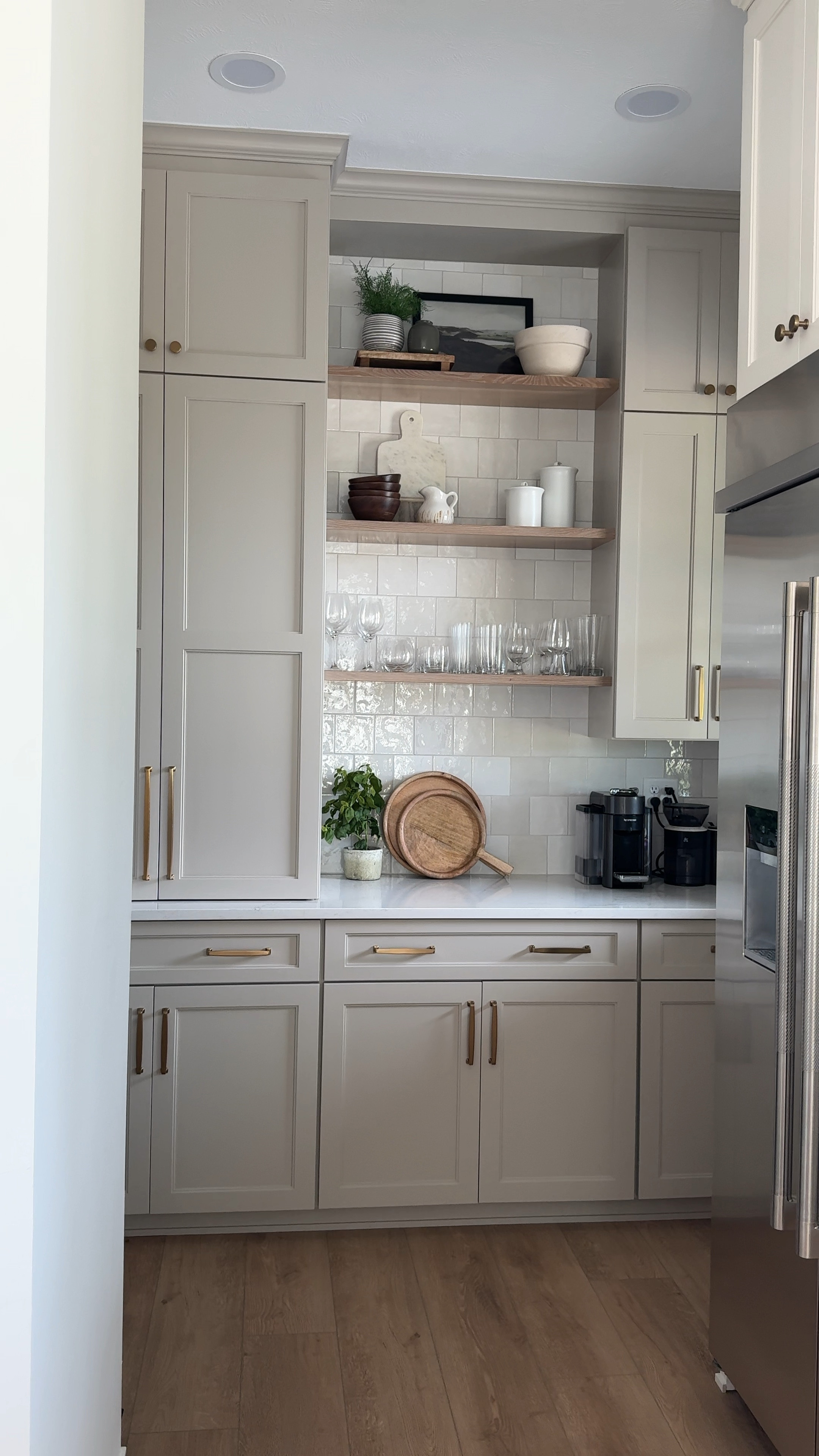 Our new butler’s pantry area. I love how this space turned out! The mix of open shelving and closed cabinets creates a beautiful balance between functionality and style. The warm tones of the wood complement the sleek finishes, making this a perfect spot for both display and storage.

#LTKStyleTip #LTKHome #LTKVideo