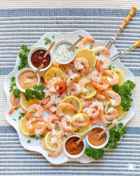 This shrimp cocktail board is the perfect start to a meal or for lighter fare, it IS the meal. charcuterie board grazing board cheese board snack board party food white platter entertaining idea pool party food mini spoons ramekins

#LTKunder50 #LTKstyletip #LTKhome