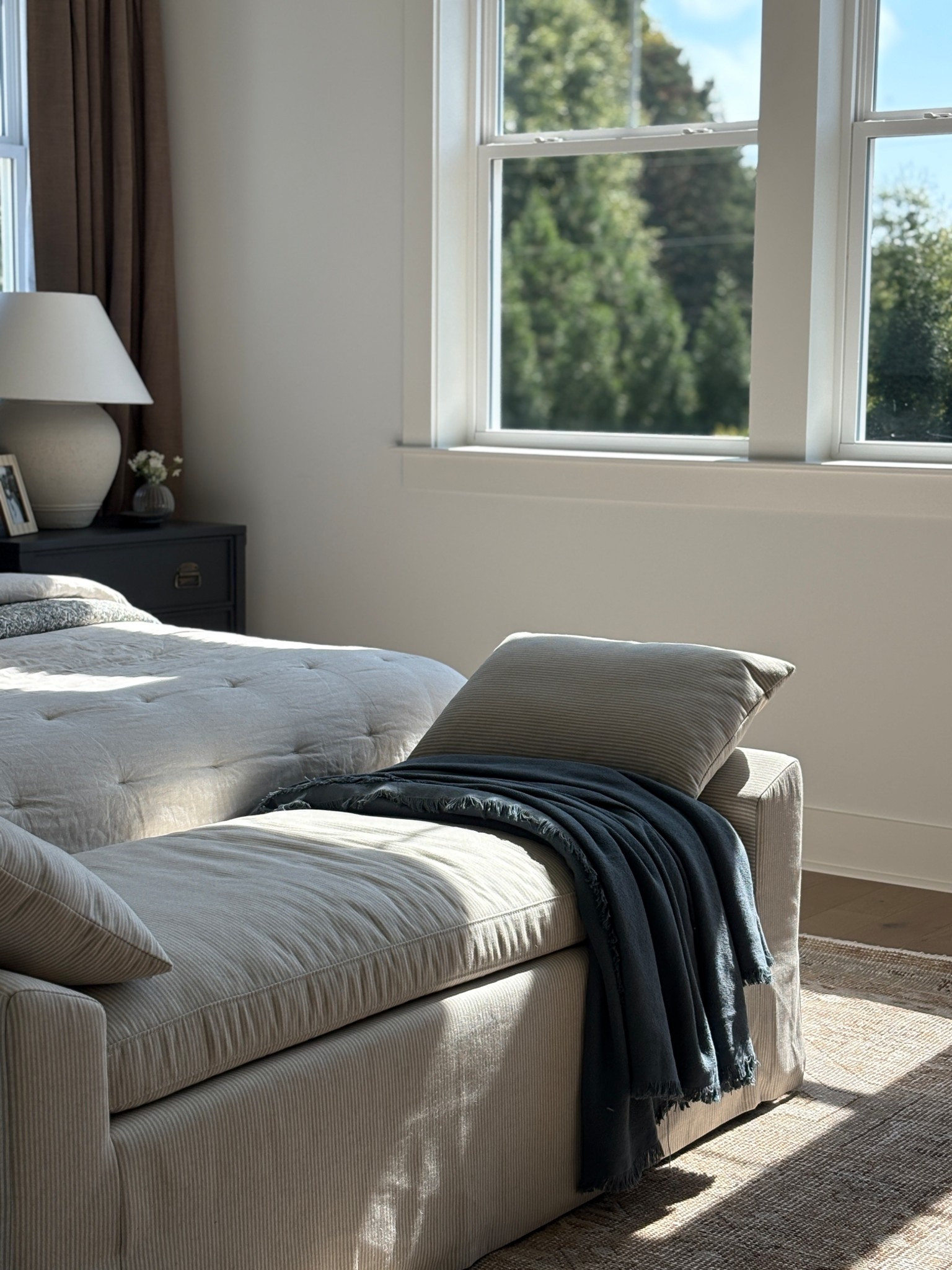 The most gorgeous light in our master bedroom, added this end of striped bed bench from McGee & Co to create the perfect reading spot. Love this layered neutral look! 

#LTKHome