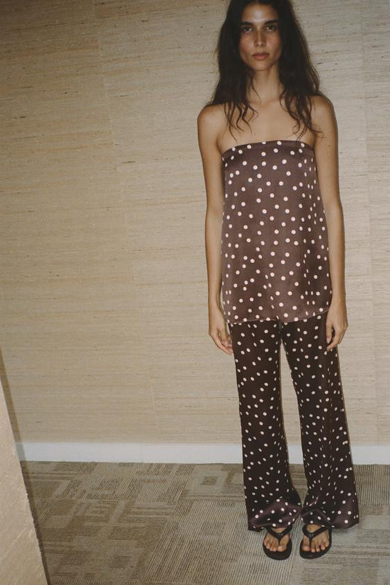 Trousers made in a satin fabric. High waist with concealed side zip fastening in the seam. | Zara UK