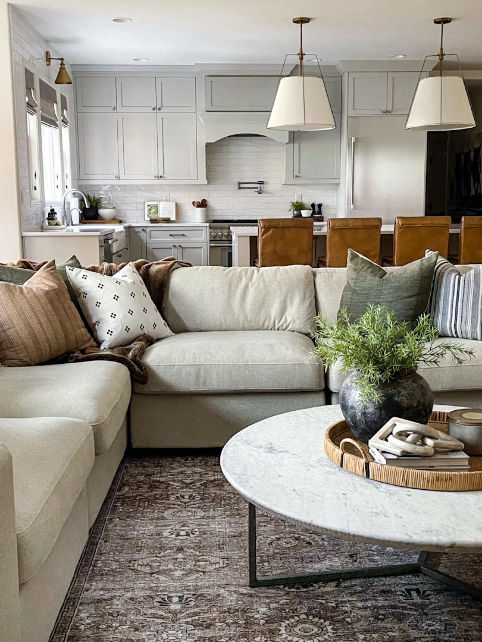 Timeless living room. Area rug, coffee table, counterstools, throw pillows, sectional, sofa, pendants, lighting, decor

#LTKfamily #LTKhome #LTKstyletip