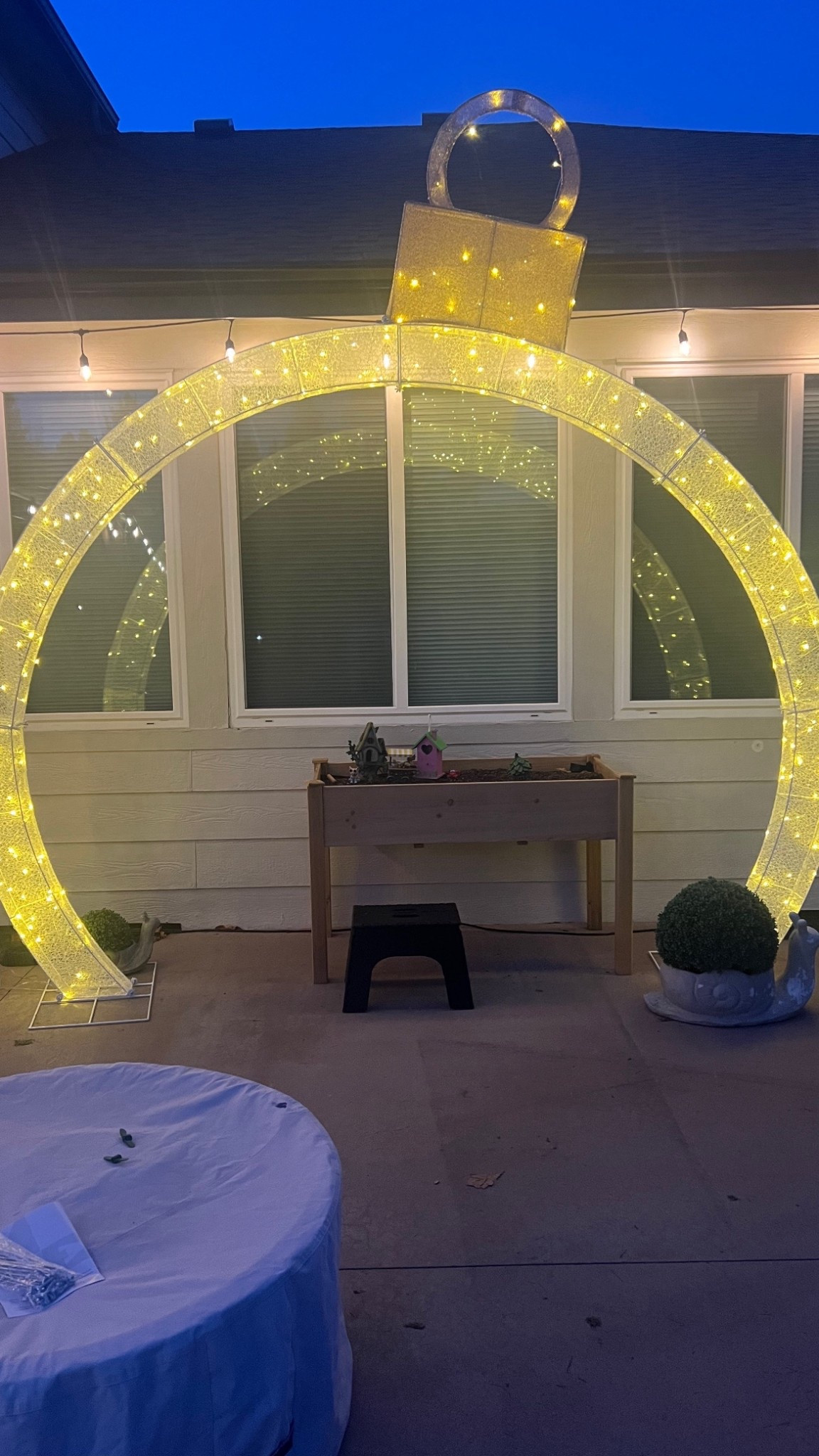 Obsessed with this ornament arch! The website pictures are wrong! In the day this is white and at nights it ls a warm yellow glow from the lights ! 

#LTKHome #LTKSeasonal #LTKHoliday