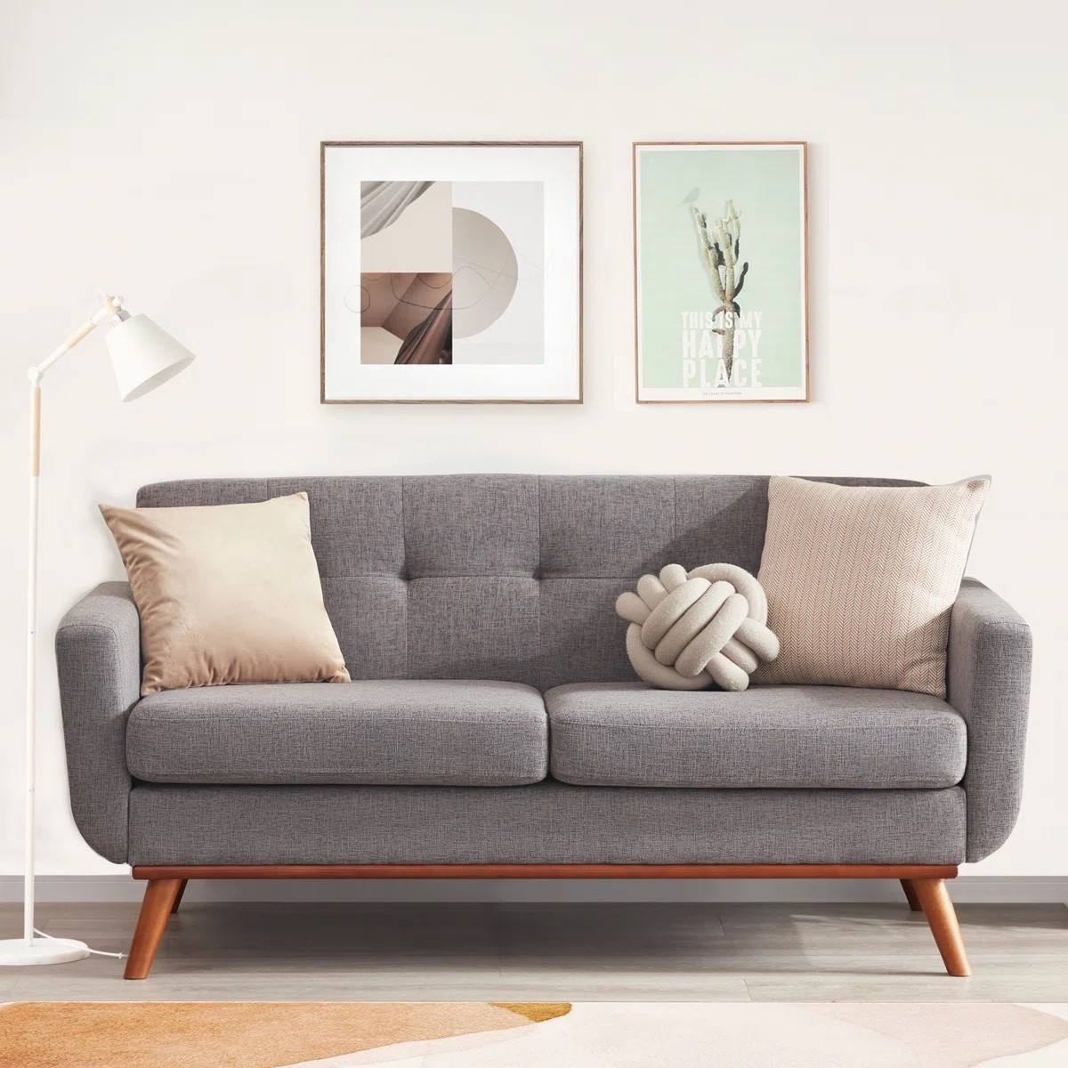 This gray linen loveseat from Wayfair is the perfect blend of comfort and modern style 🛋️✨ Featuring clean square arms, soft upholstery, and warm wood legs, it adds a cozy yet elevated feel to any living room. Styled with neutral throw pillows, wall art, and a floor lamp for a simple, curated look. 🤍 A great piece for small spaces or apartments. 