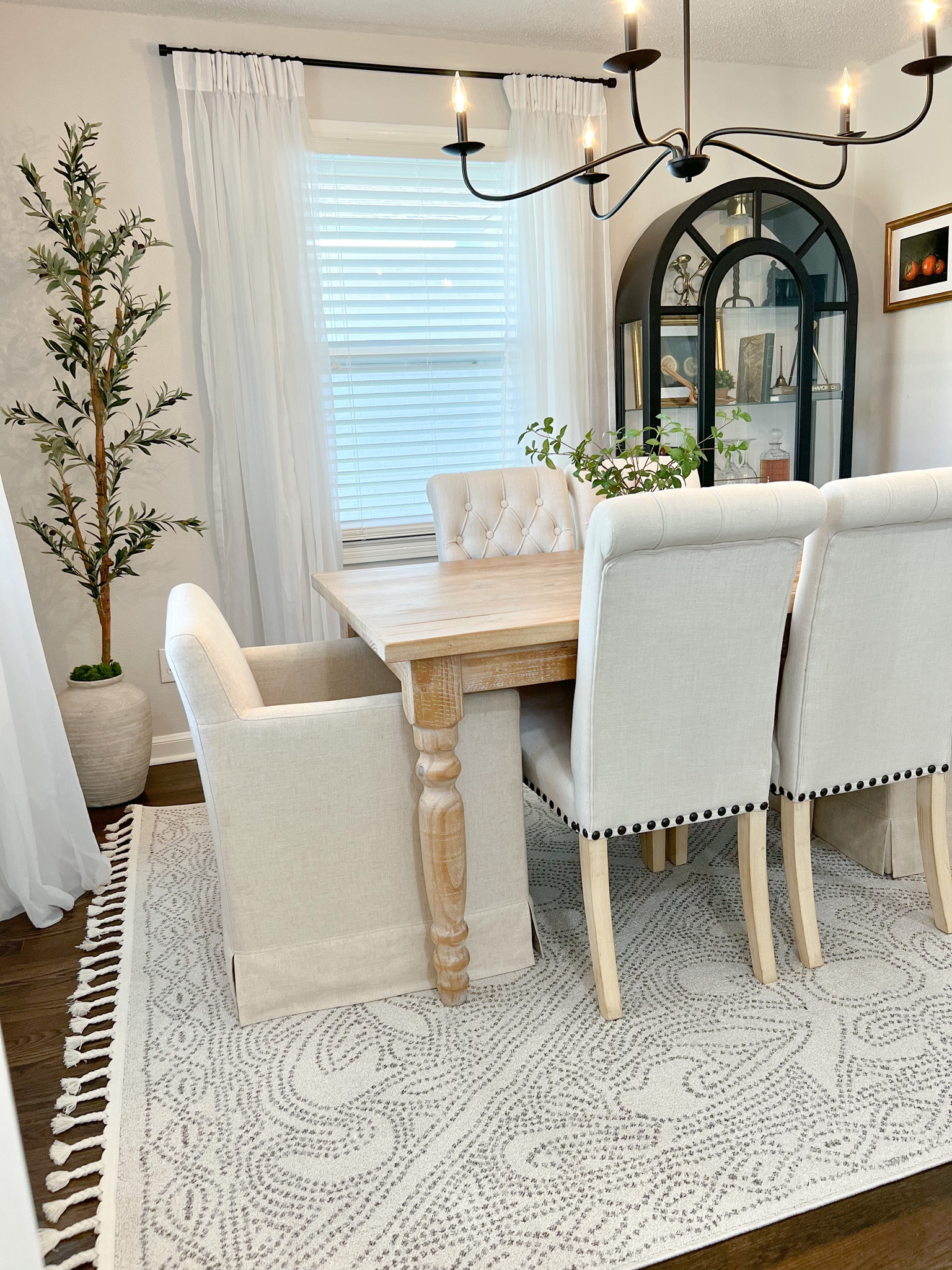 Dining room sources including furniture like table, chairs, upholstered chair, chandelier, rug, olive tree, and home decor #homedecor #furniture #ltkfind #competition 

#LTKFind #LTKhome #LTKstyletip