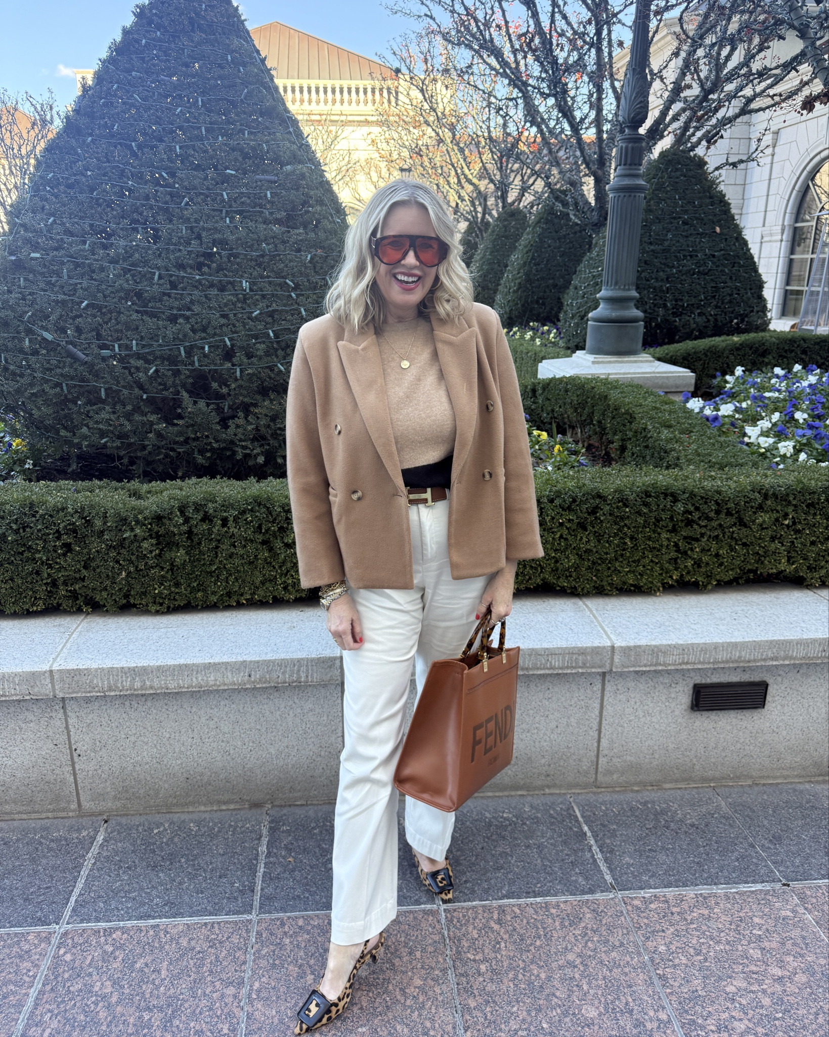 Outfit of the day ⚠️Sharing discount codes 

Fendi leather tote with tortoise handles ⚠️get one month FREE with my code DARCzy

Best selling Sunnies
🕶️ Tom ford inspired by.. comes in a two pack for under $20 

Lip combo linked as well as compass necklace 

Camel hip length coat, so affordable and comes in other colors and fits tts

Cashmere sweater by Chicos (old linked) similar 

New Spanx front pocket trouser 
Fit tts ⚠️save 15% off with code Deardarcyxspanx 

Fendi designer bag 

Leopard kitten heal (old Anthro) 
I linked similarr

Hermes designer belt 


#LTKOver40 #LTKootd #LTKWorkwear