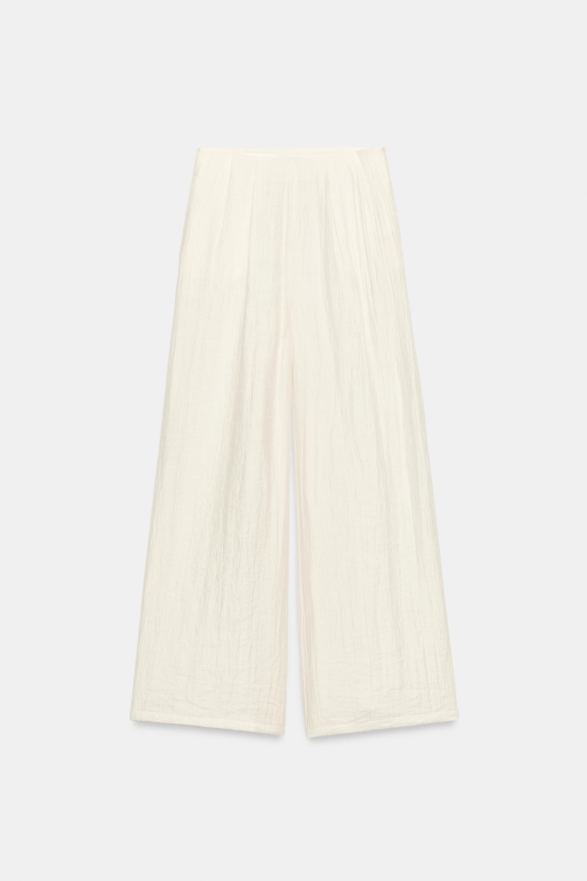 DescriptionContentsMeasurementsHigh-waisted pleated pants with front pockets. Wide leg. Hidden in... | Zara US