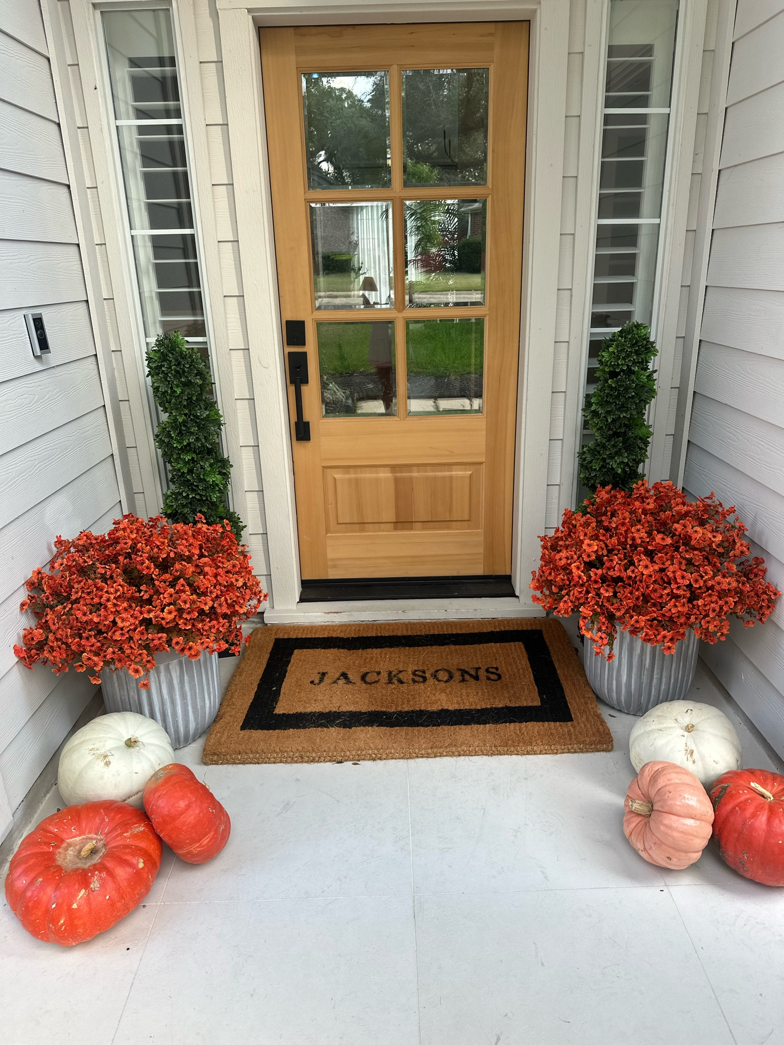 Fall faux mums!! I bought two of the 36 green orange bundles then put them in a nice planter with two foam boxes to hold the stems  