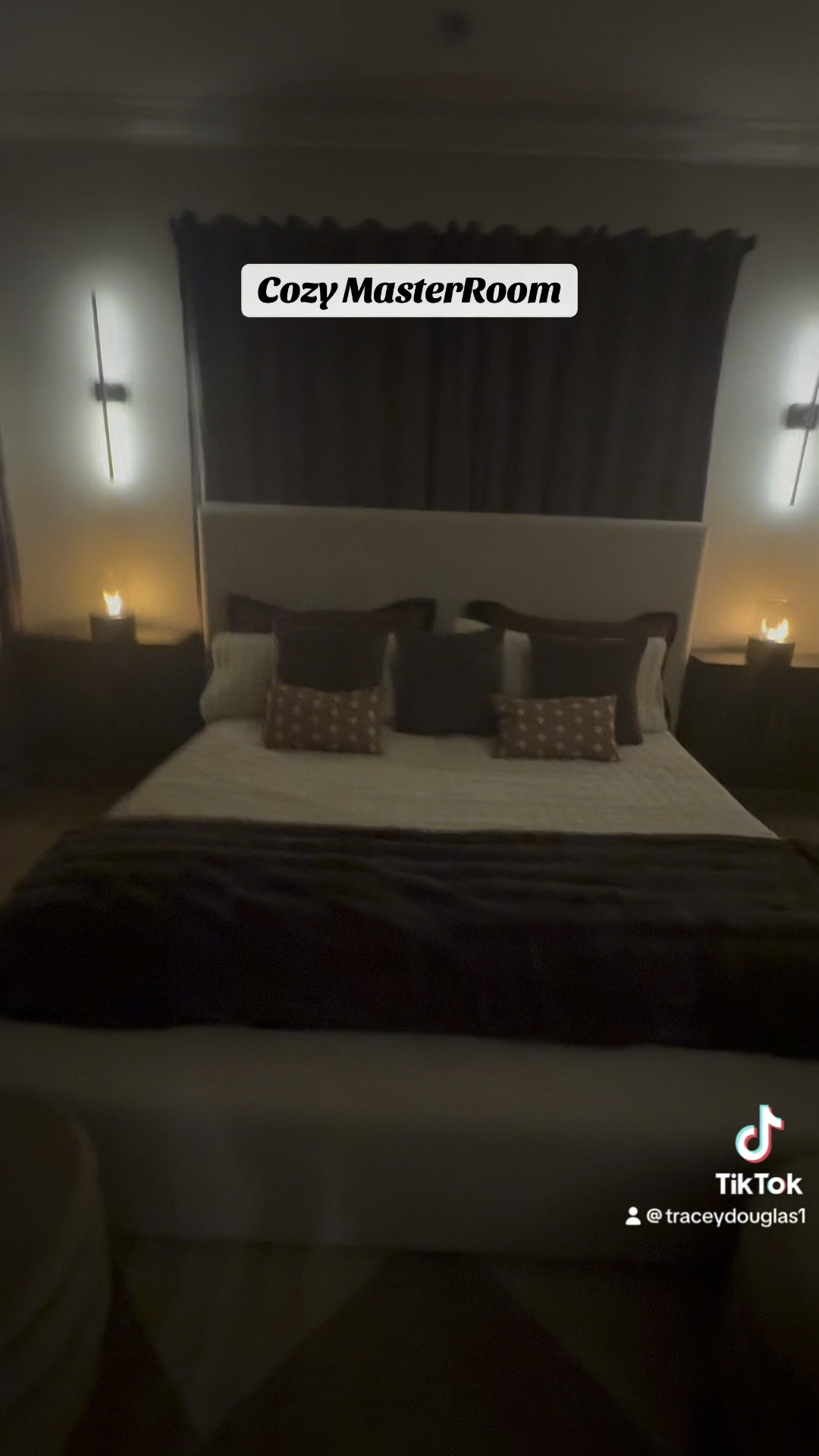 Loving all the chocolate textures I added to my master bedroom. The sheets are so soft with deep pockets and the quilt feels so luxurious! The faux fur blankets add texture and the throw pillows are a perfect filler. The velvet room darkner drapes look and feel high-end but a fraction of the cost!! Added these beautiful remote battery operated Wall Sconces with 3 light settings to avoid hard wire or exposed cords. The table firepits and night lights add another layer of ambiance.
Add a touch of grennery and the black stems to soften the room. The beautiful rug pulls the floor and wall color together nicely.,#masterbedroom #homedecor #moodymasterbedroom

#LTKStyleTip #LTKHome