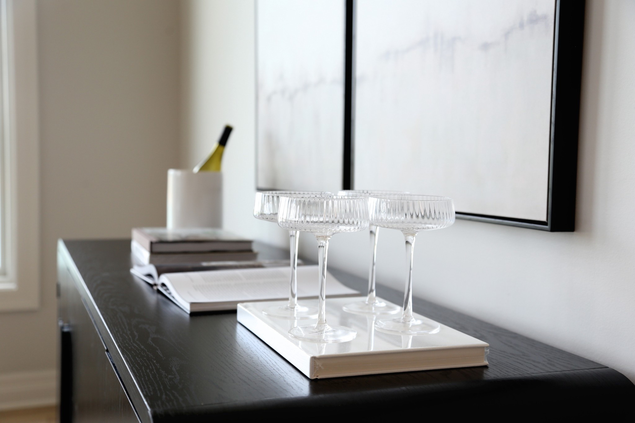 Dining room styling. Books are the best way to make a simple elegant touch. Cocktail glass, kitchen canister, sideboard 

#LTKStyleTip #LTKHome #LTKFamily