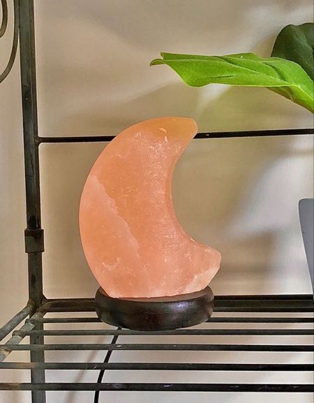 Himalayan salt lamp shaped like a glowing crescent moon that brings celestial energy to your space. Fit with a sturdy wooden base, it includes a cord to plug into any outlet for easy use. 

#LTKhome #LTKunder100 #LTKfamily