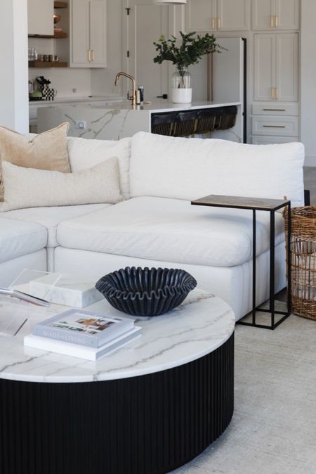 Living room decor with white sectional, marble coffee table, large basket, martini table, and our favorite ruffle bowl. We love our bowl because it’s black marble, large enough to store stuff and looks very sleek  

#LTKHome #LTKStyleTip