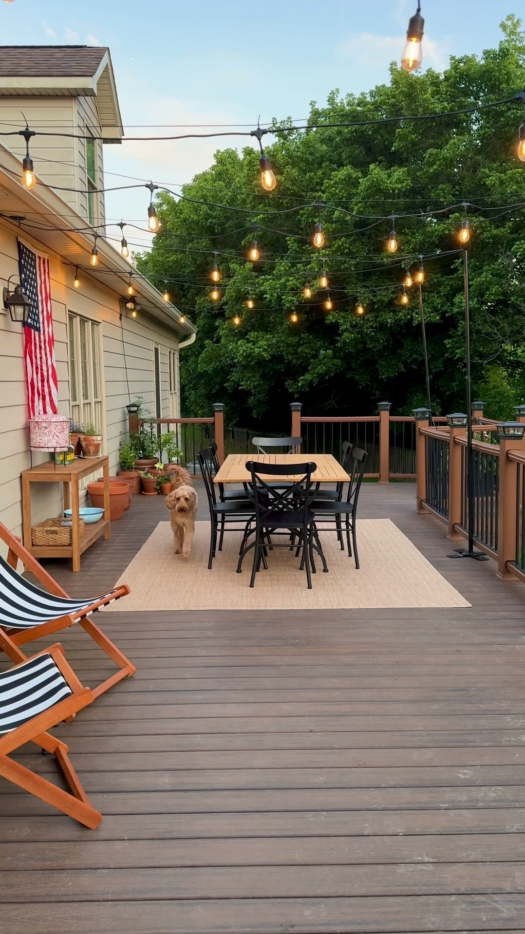 Patio Bistro Lights 
Patio Lighting Inspo 
Modern Traditional Patio Decor 
Classic Timeless Patio 
Washable, stain resistant outdoor rug 
Teak patio table 
Teak patio console table 


#LTKHome #LTKSummerEdit