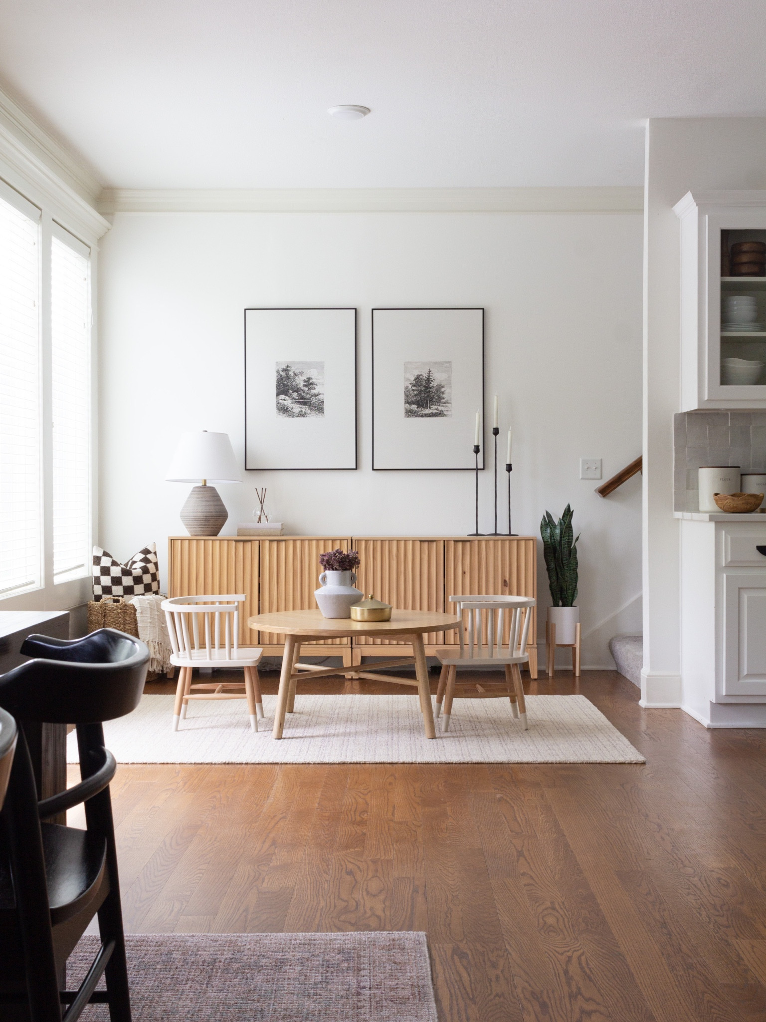 I love our “kid corner,” as I like to call it! We have an open concept main level, this is right off of our dining/kitchen.  I wanted to create a space that was both cohesive to my main level design & practical for my family.  This is where I have landed, with some minor updates still to come! 

This small table shown here is actually a @studiomcgee coffee table.  It works perfectly as a “kid table,” when paired with these adorable small chairs.  My kids do Play-Doh, crafts, color & play with their toys at this table.  The cabinets behind it are filled with baskets of toys & craft supplies.  It’s been a great solution for our family! 




#LTKhome #LTKstyletip #LTKunder100