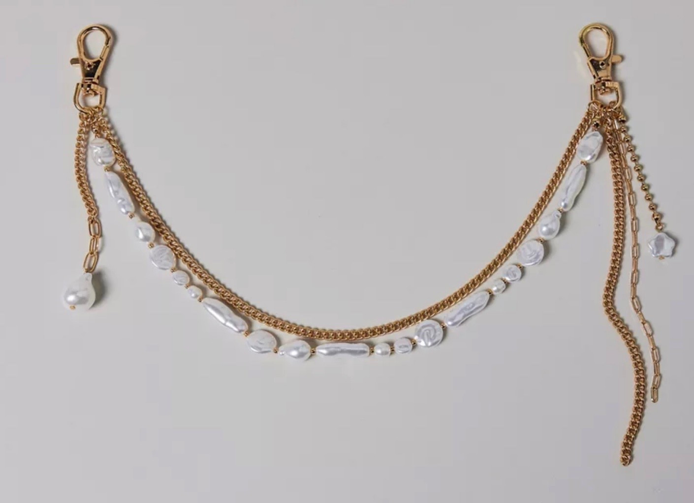 Gold chain & pearl charm bag chain #bagchain #bagcharm #urbanoutfitters

#LTKStyleTip #LTKFindsUnder50 #LTKItBag