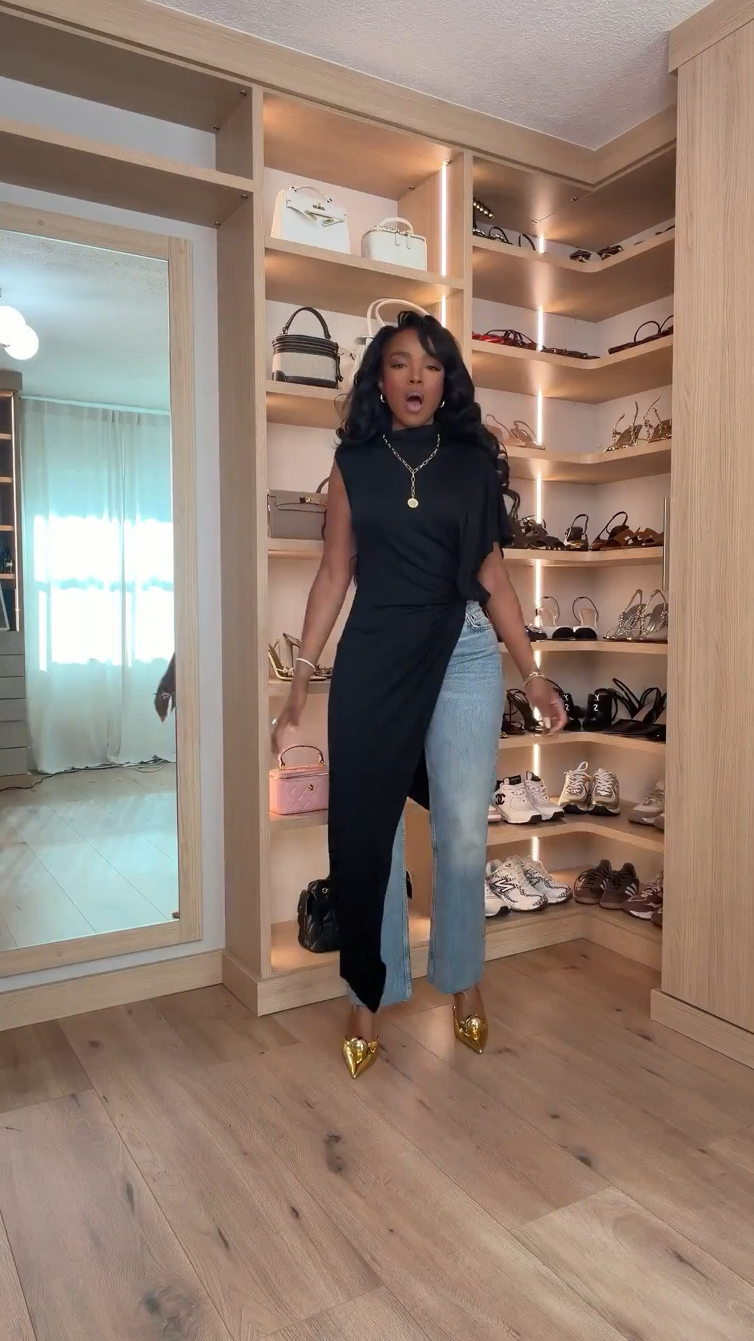 Hi Babes!

This outfit is proof that basics don't have to be boring. The dramatic black asymmetrical top paired with relaxed straight-leg denim creates the perfect high-low mix of elevated and effortless. Add the statement gold heels and suddenly this simple denim look feels fashion-forward, expensive, and completely unforgettable.

If you're petite and curvy, this look is incredibly flattering because the flowy asymmetrical silhouette adds movement while the structured denim keeps everything balanced. The open-back detail makes this outfit feel special without trying too hard.

Where to wear this:
• Date nights
• Girls night out
• Dinner reservations
• Fashion events
• Concerts
• Vacation evenings
• Birthday celebrations
• Rooftop cocktails

Undergarments: Adhesive bra or nipple covers for the cleanest look with the open-back design.

Everything is linked below.

xx Kira | IG: KirasFashionFinds

34D - 27 - 40 • Size Small or 4

Follow me on Instagram and YouTube @kirasfashionfinds

#LTKgrwm #LTKootd #LTKPetite