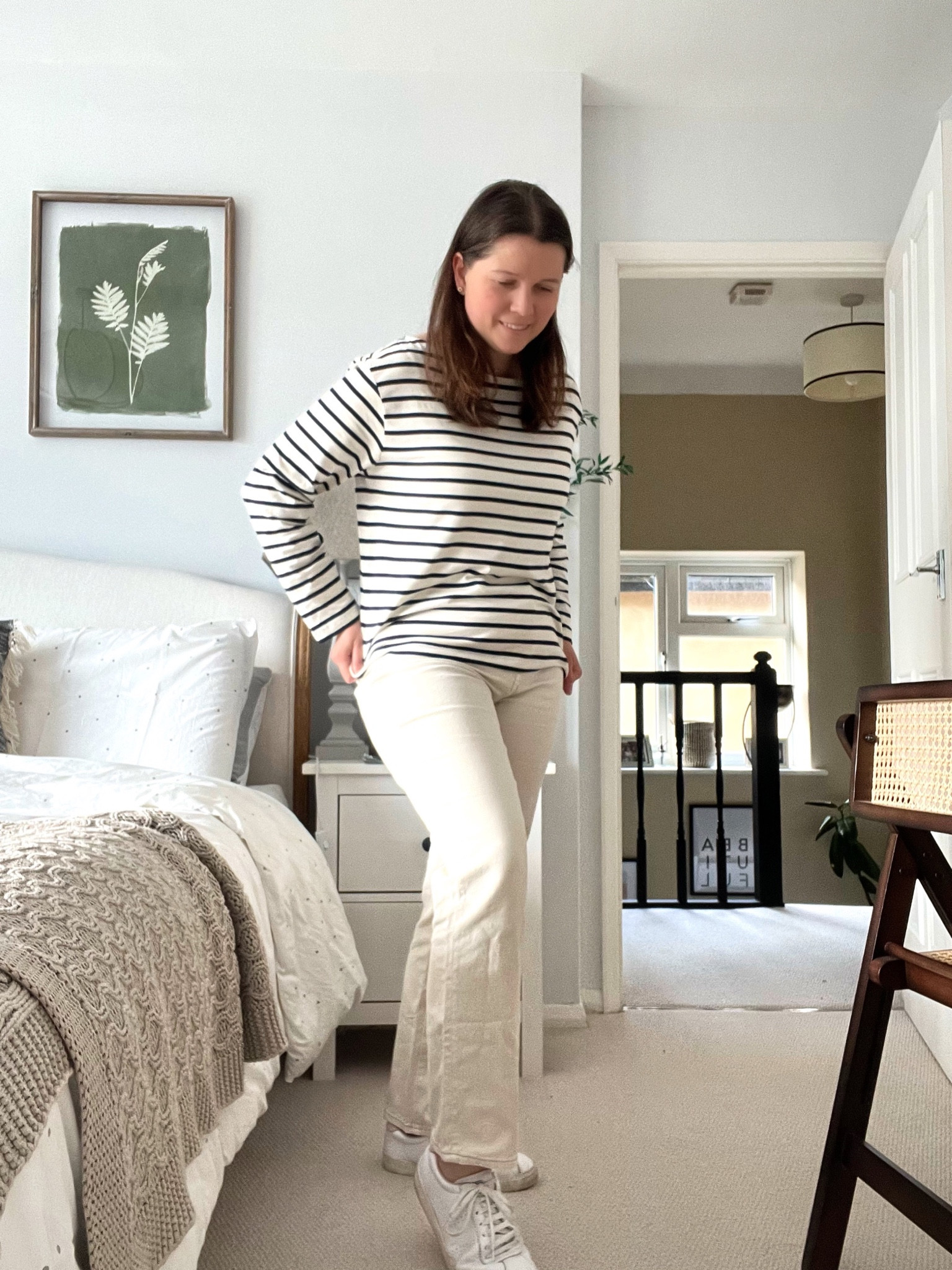 White and blue Breton stripe long sleeved top, lightweight. And white denim mom jeans with a high waist and white trainers. Great for transitional season 

#LTKunder50 #LTKSeasonal #LTKeurope