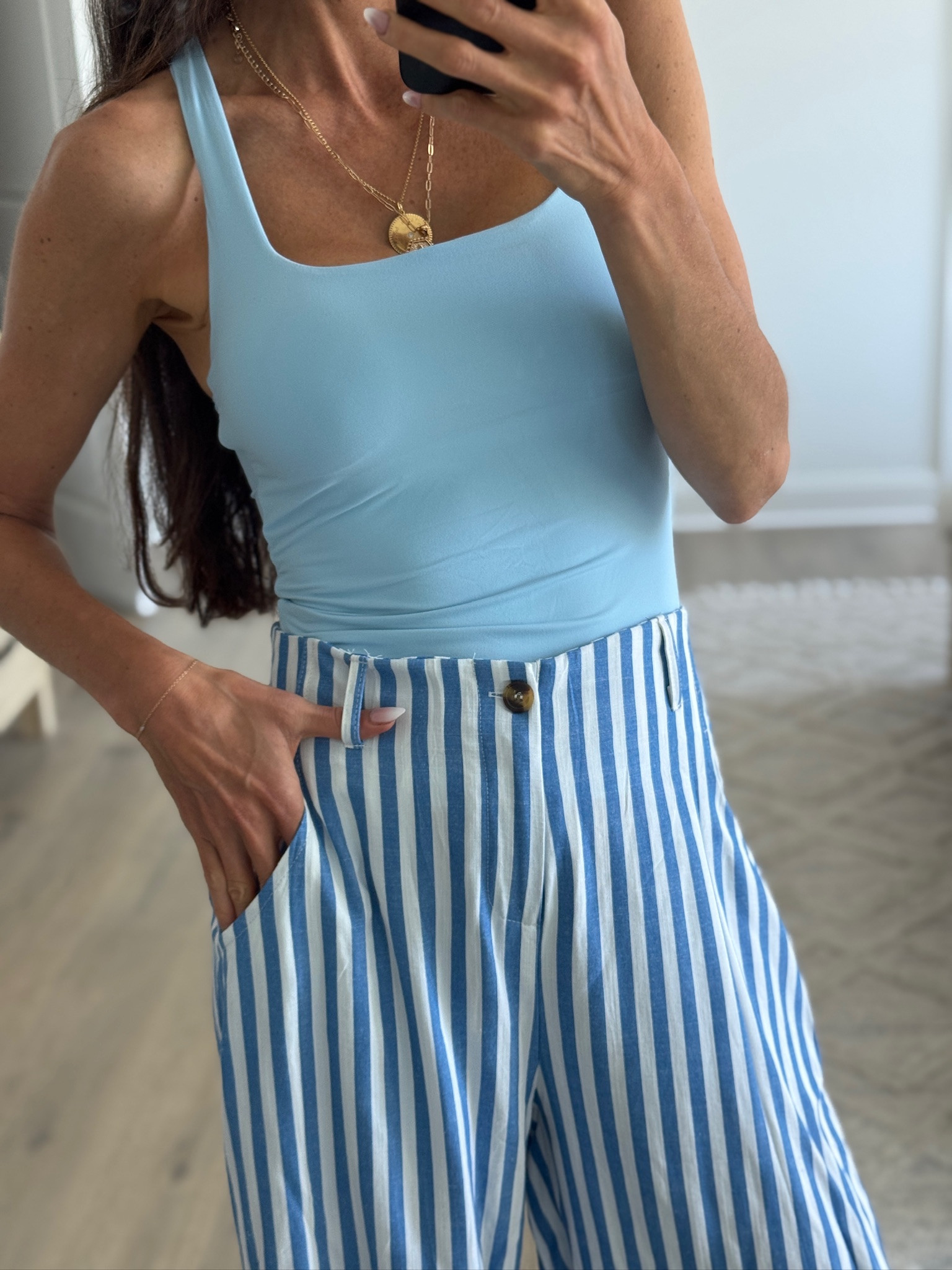 Summer outfit formula I’ll be repeating on repeat. These blue striped wide leg pants are so flattering and give that effortless coastal summer vibe paired with a fitted tank, woven sandals, and simple gold jewelry. Such a good casual outfit for vacation, errands, brunch, teacher summer, or everyday mom style.

#LTKSeasonal #LTKmomlife #LTKootd