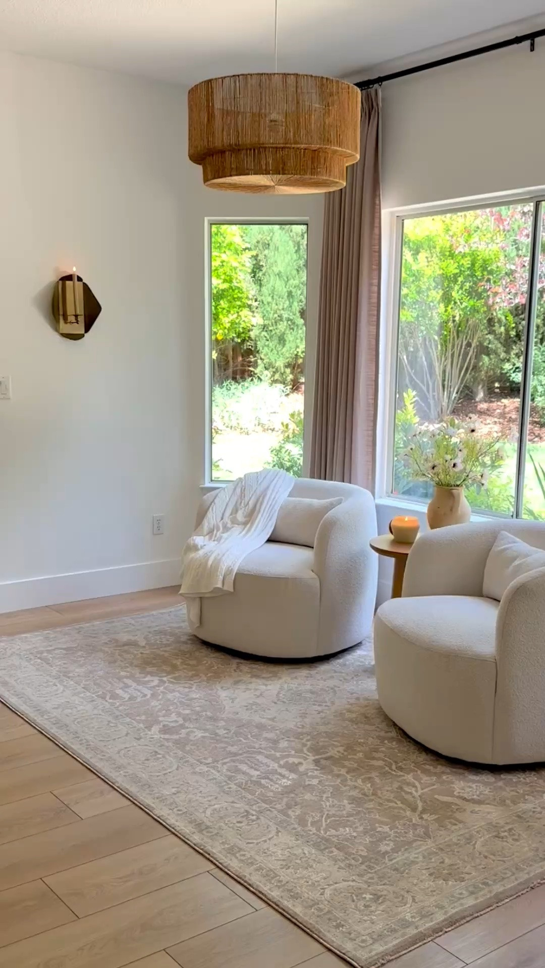 Sitting nook ☕️📖

Love how this space feels complete with my new rug. Love the soft tones and texture, the classic print and timeless look. Size here is 6x9, color tan. 

Curtains: Two Pages Liz linen color gray beige, triple pleat, memory shape. Use code PAULABHOME for 22% off your Two Pages order. 

Neutral area rug, swivel chairs, linen curtains, candle sconce, cozy corner.

#LTKHome #LTKU