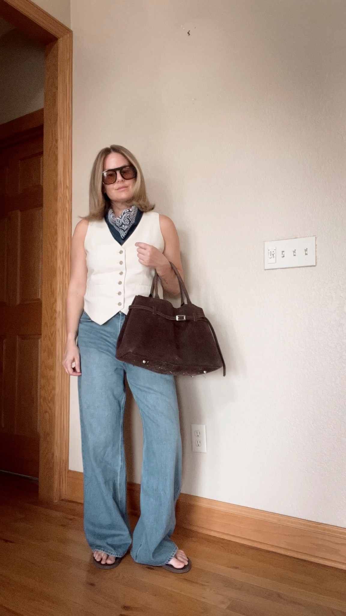 THE EDIT: suit vest, bandana, baggy denim, suede bag, sunglasses. 