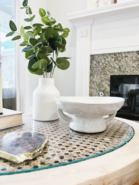 This little white decorative bowl is back in stock. This is one of my favorite pieces to move around. Sometimes I fill it with bowl filler, and other times it remains empty. 

Linking a few table options as mine was a DIY. Also linking my favorite new floor lamp (not visible in this photo) because it’s back in stock and under $70. 

Living room decor, living room corner decor, side table decor, accent table, end table, home decor, white footed bowl, little white decorative bowl, bowl with handles, eucalyptus stems in white vase, small fake plant, table plant, greenery, simple decor, coasters, agate coasters, Anthropologie finds, Amazon home decor finds, Marshall’s decor, cane table, table with rattan shelf, round glass and cane table, pleated lamp shade, accordion floor lamp, modern floor lamp

#LTKunder100 #LTKhome #LTKFind