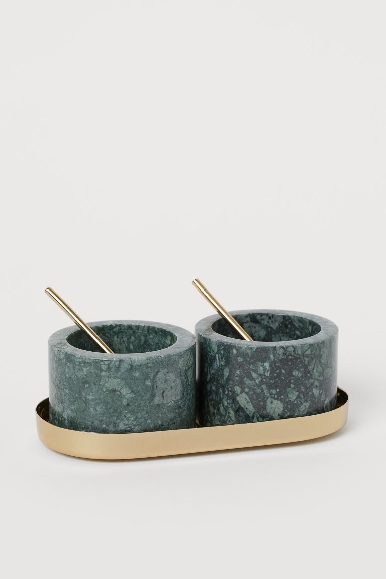 Small stone bowls for salt and pepper. Each with serving spoon. With oval metal tray. Diameter of... | H&M (US)
