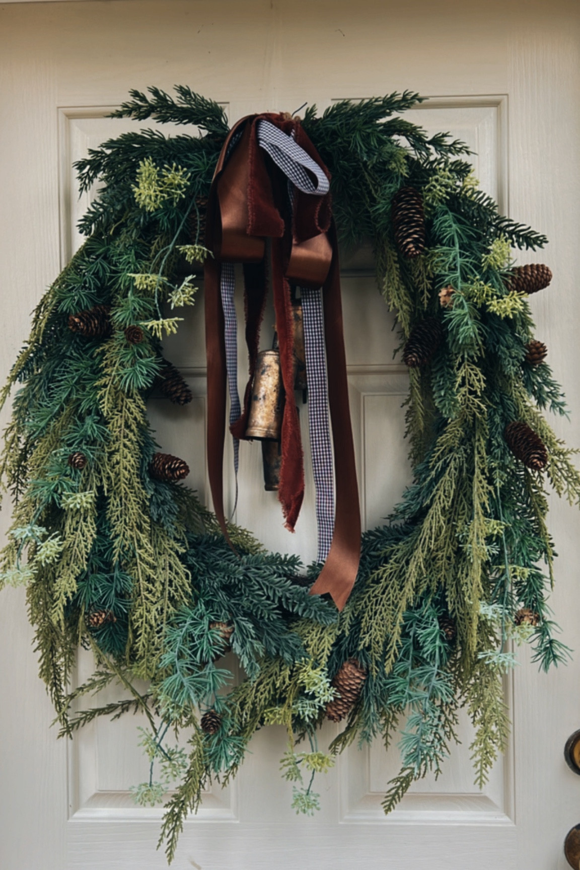 McGee and co wreath with layered ribbons and bells! Love layering velvet and satin ribbons together!

Brown gingham ribbon mixed in too!

#LTKHoliday #LTKHome #LTKSaleAlert