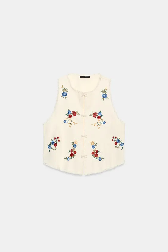 Round neck sleeveless top. Contrasting embroidery and frayed trim detail. Front hook-and-eye clos... | Zara US