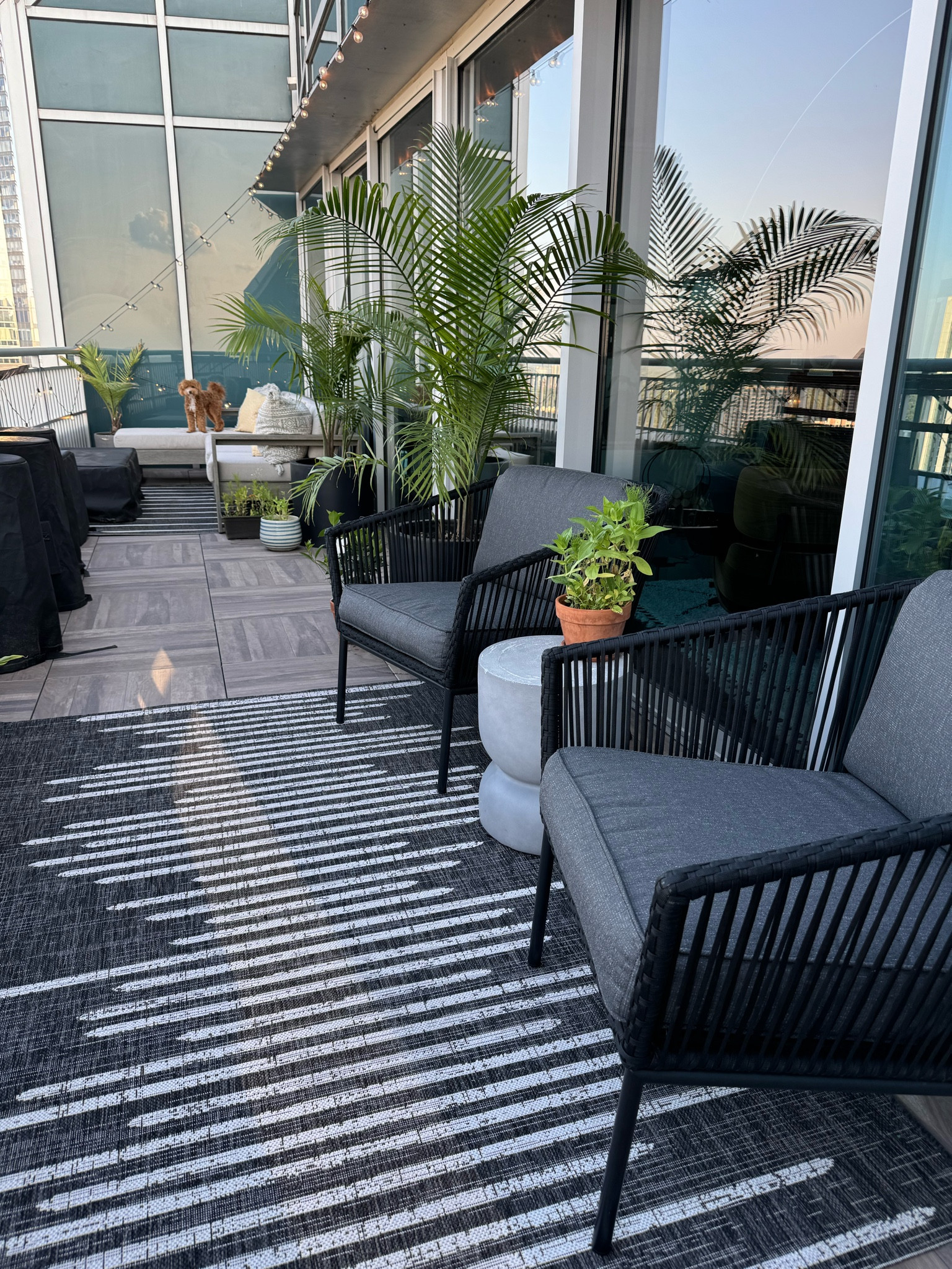 Outdoor balcony/patio space  inspiration. Outdoor sectional (in the back) is customizable from West Elm. Outdoor chairs, rugs, and side table are from Target. 

#LTKHome