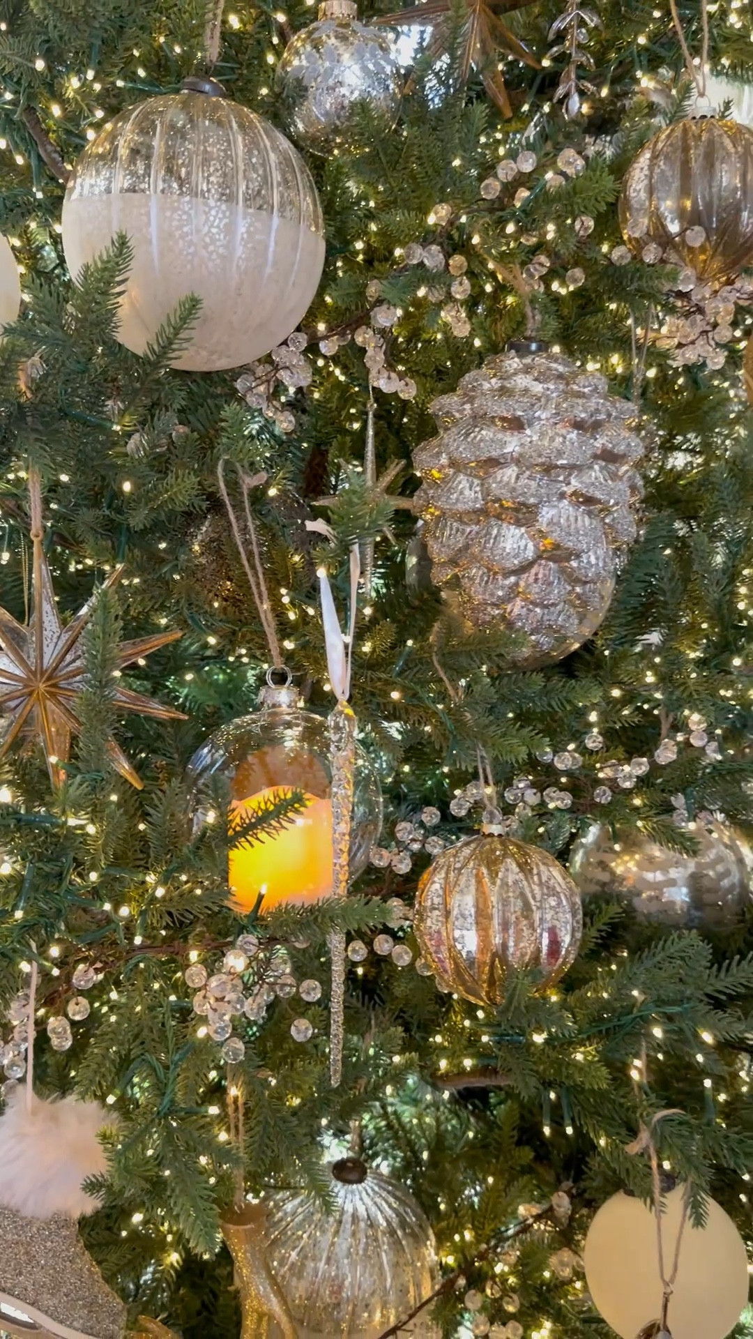 The tree in our living room is all decorated!  
I started with 7 strands of beaded string lights.  They look like sugar and snow on the tree.  Then I filled in with my larger ornaments and worked my way down in different sizes and shapes.  It’s my most favorite tree I have done!  I linked all my new ornaments below!

#LTKHome #LTKHoliday