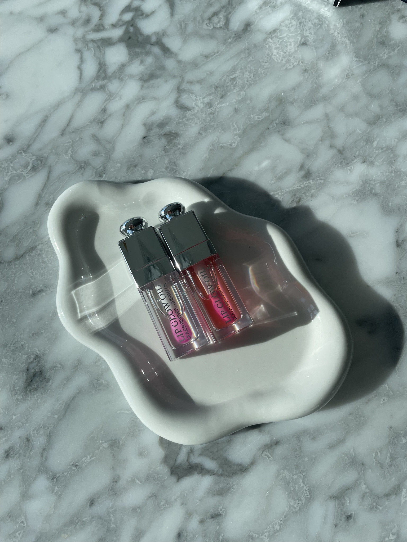 The Dior Lip Glow Oils are the perfect everyday lip product if you want shine, colour and actual hydration. Packed with cherry oil, they give your lips a glossy, mirror-like finish while keeping them soft and moisturized for hours. Each shade adjusts to your natural pH to create a custom tint that enhances your own lip colour. The formula feels lightweight and comfortable with zero stickiness, so you can wear it on its own for a natural glow or layer it over lipstick for a fuller, juicy look. It is one of those beauty staples that always looks good and always feels good.

#LTKSeasonal #LTKHoliday #LTKBeauty