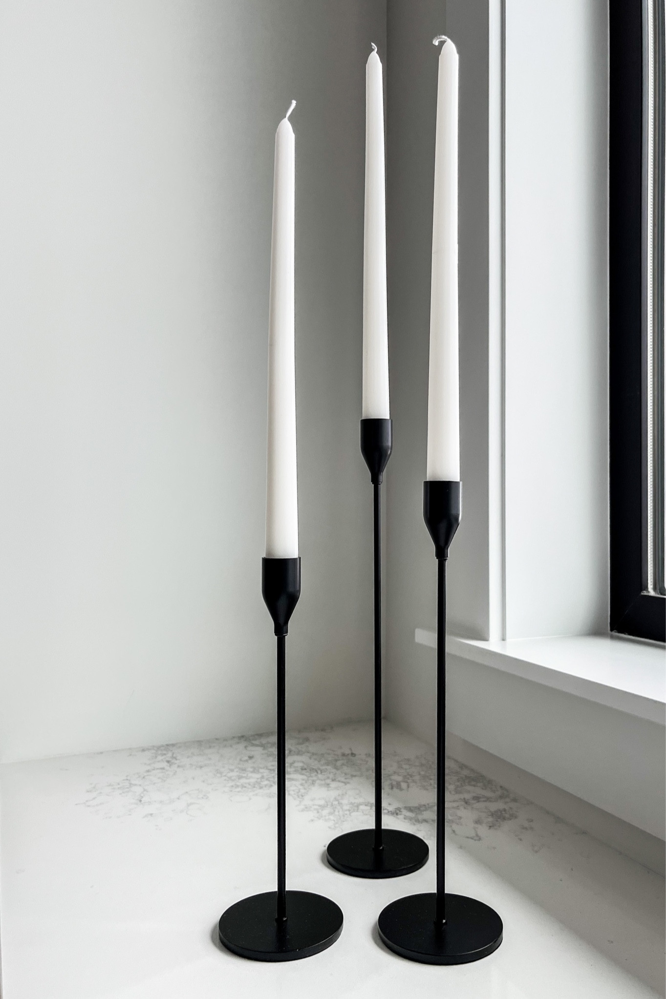 H O M E / this set of black metal candle sticks (I have 2)  is such a great deal. Love them for all year round styling, but 🤌🏻 for Christmas. 

I have the regular tapered candles, but would like to try the flame less as well, peace of mind especially with small children! 

#LTKhome #LTKHoliday #LTKfindsunder50