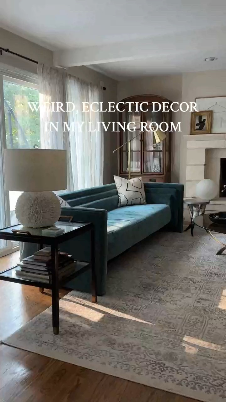 Come tour my funky, eclectic living room! It’s filled with a mix of vintage decor and modern furniture. Hope it inspires you to get creative and unique.  

Eclectic living room ideas, funky decor aesthetic, boho living room, teal sofa, blue couch, brass and glass coffee table, neutral rug, artist decor style, small living room, cozy eclectic living room, arched cabinets, arched display cabinet, black side table, interior design 

#LTKStyleTip #LTKHome