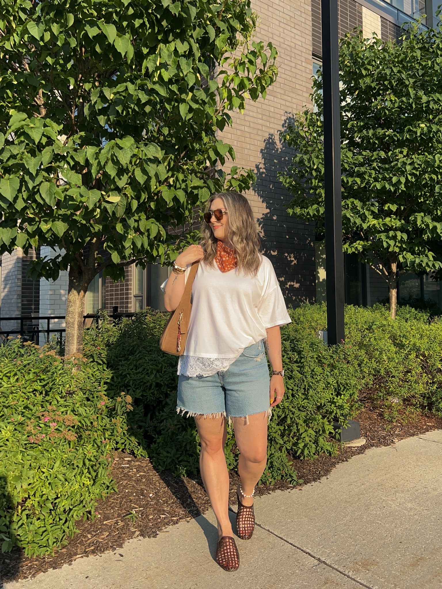 Easy summer outfit! Wearing L in the lace trim tee and sized up to 32 in the denim shorts for a loose fit. I’m a 9.5-10 shoe and wear a 10 in the jelly shoes. Canadian tee & shoes links are under “similar products”. Also linked similar bandanas

#LTKsummer #LTKsale #LTKmidsize