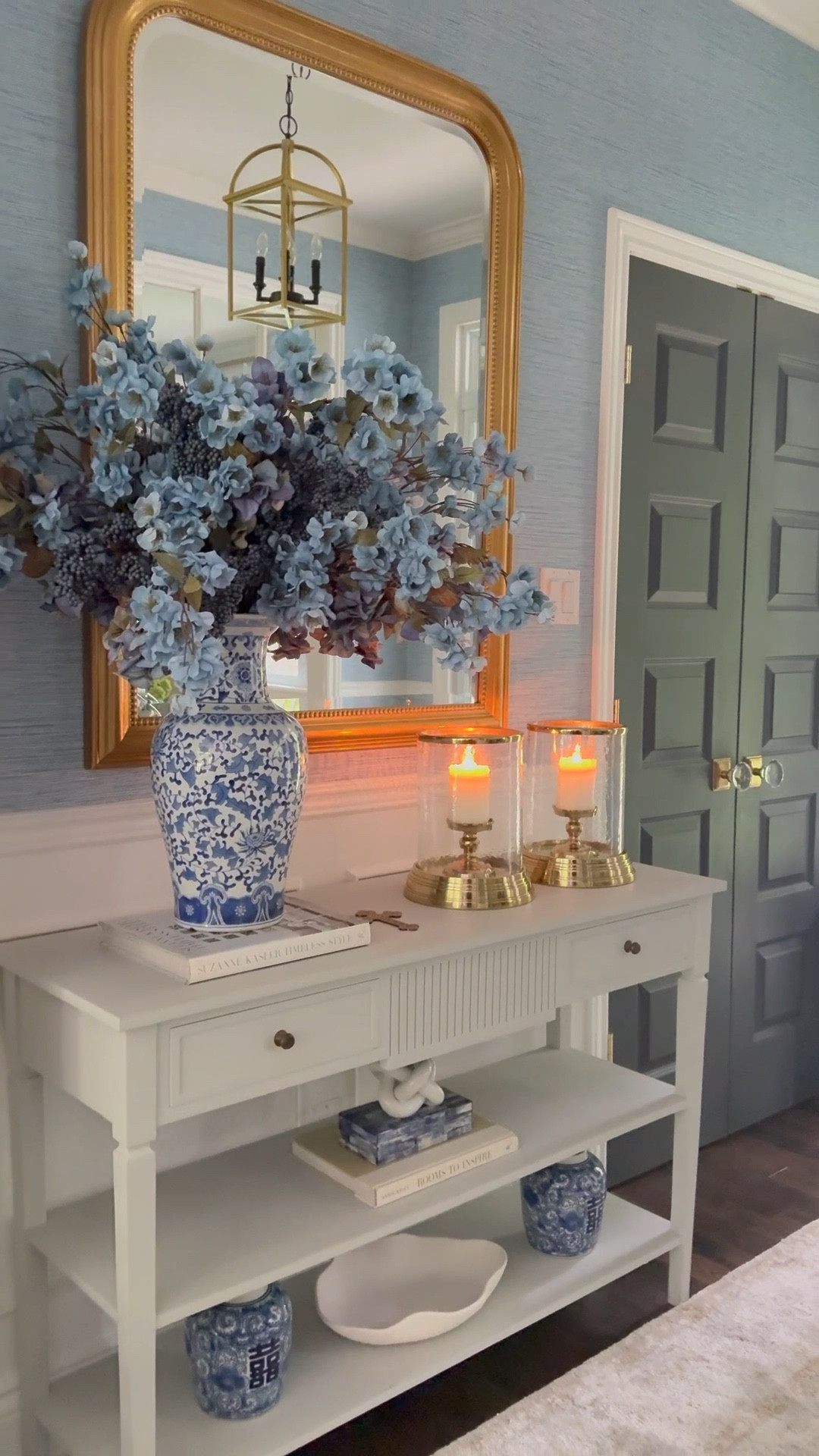 Chic layers of blue and gold in our fall entryway! Create a moody vibe with gorgeous hurricane lanterns and a gorgeous oversized floral arrangement to welcome guests!

#LTKHome #LTKStyleTip