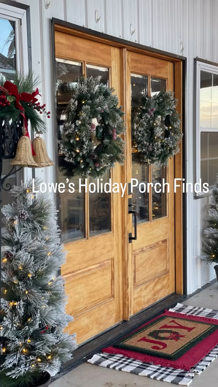 🌟Christmas season isn’t complete until my porch is decorated  by @loweshomeimprovement ❤️ these double doors were screaming for two beautiful wreaths and the we can’t forget the trees, pillows and all the things. I’m obsessed with these wreaths with 8 different settings, and auto shut off. 

Do you decorate your outdoor space? 

I will link 🔗 all my finds! You can shop them by commenting “wreath.” 

#lowespartner #loweshomeimprovement #christmasdecor #frontporchdecor #christmasporch #christmaswreath #christmastrees 
#homevibesdecortournov26