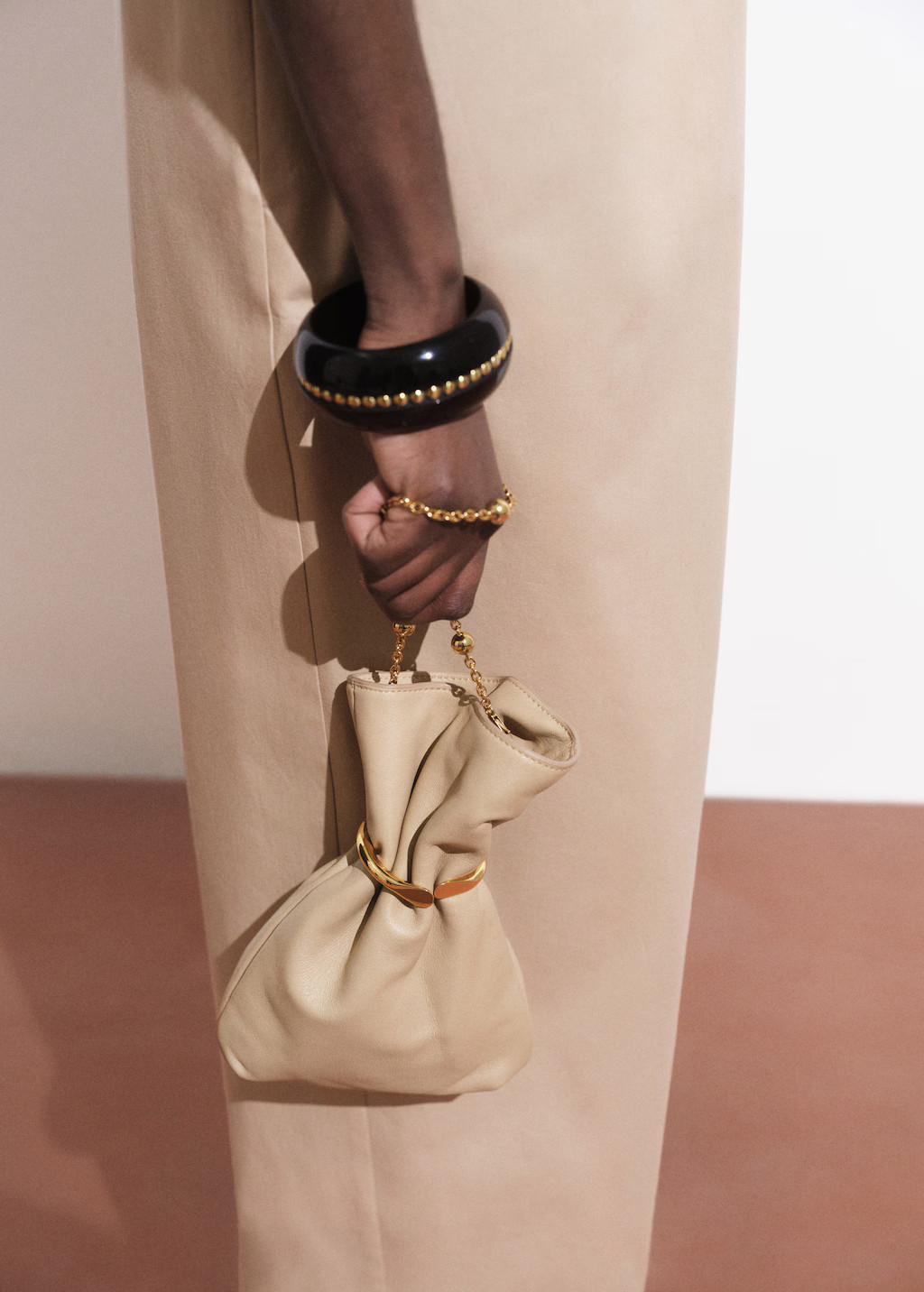 Leather sack-style bag with metallic detail - Women | MANGO United Kingdom | MANGO (UK)