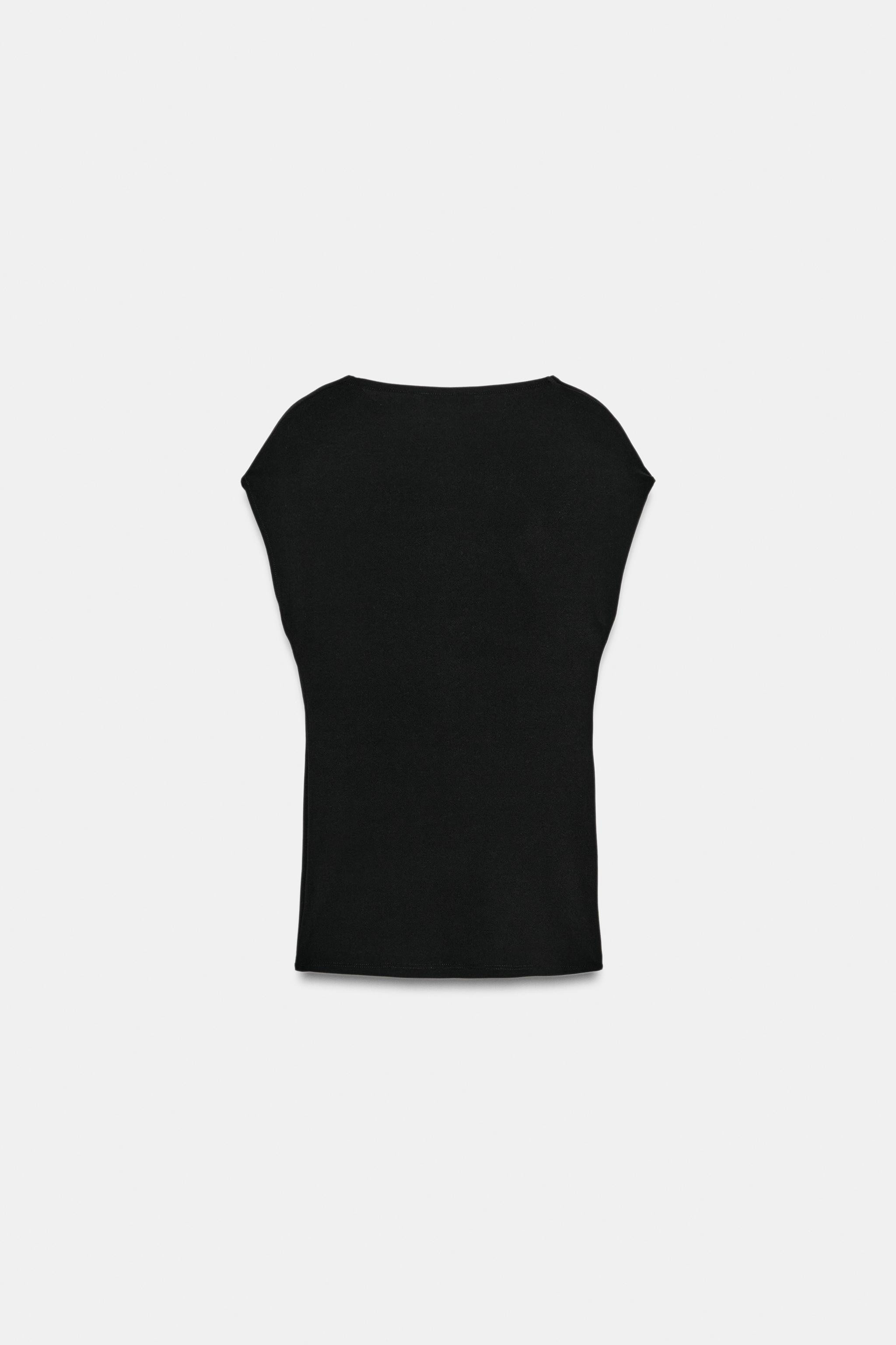 Asymmetric neckline top with sleeveless design. Featuring draped detail on the front with embosse... | Zara UK