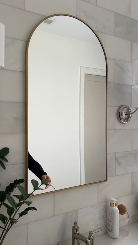 This arch mirror medicine cabinet is my one of favorite features in our home. It’s so pretty but so functional.  It keeps everything off the counter and nicely hidden. I added an outlet inside so that I can charge my toothbrush so nothing ever has to sit on the counter  

#LTKhome
