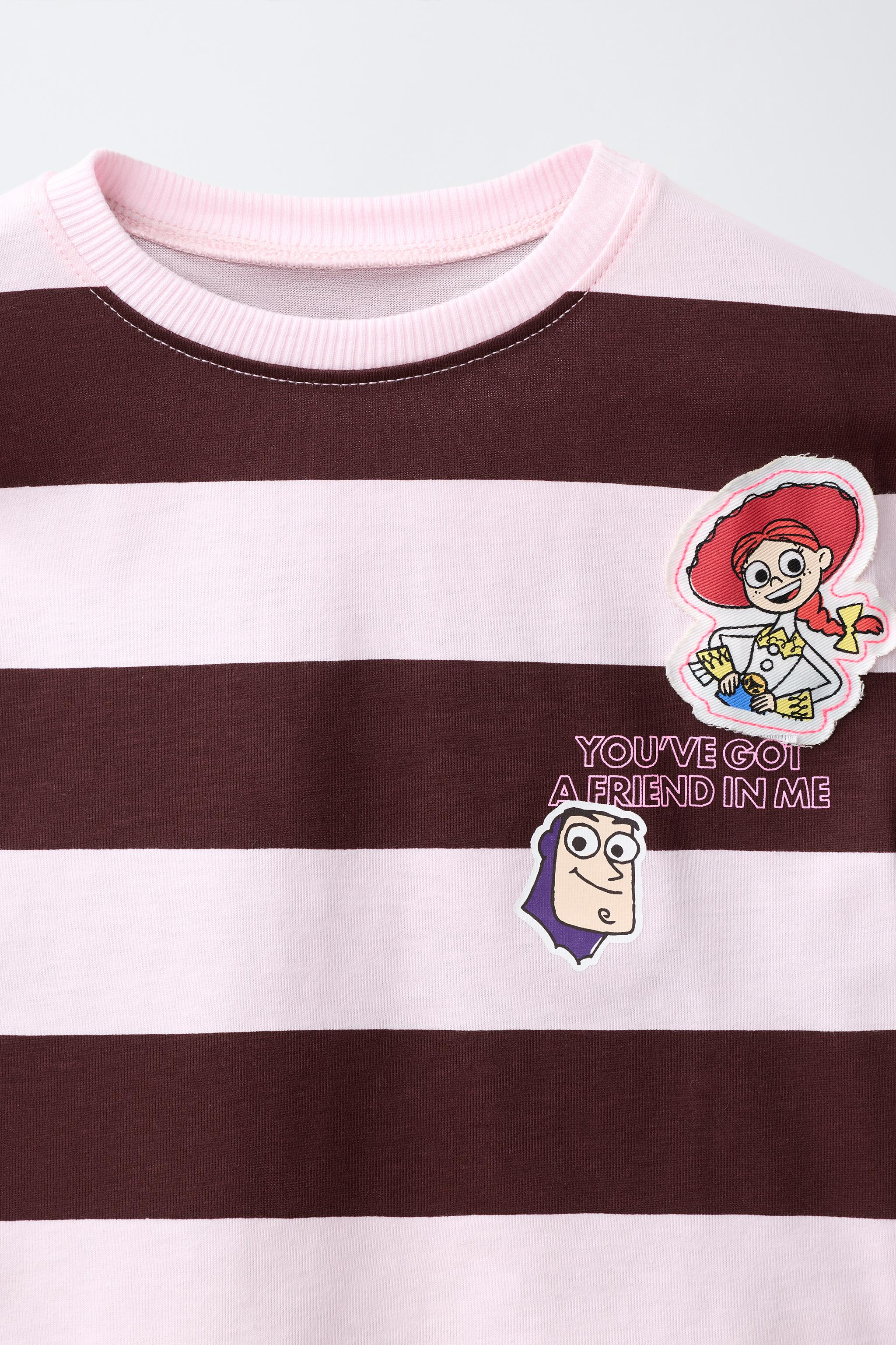 Crew neck t-shirt with short sleeves. Striped pattern and patch appliqu\u00e9s featuring TOY STOR... | Zara US