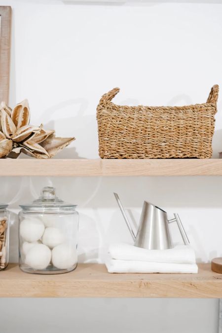 Laundry room accessories glass jars woven baskets stainless watering can 

#LTKhome
