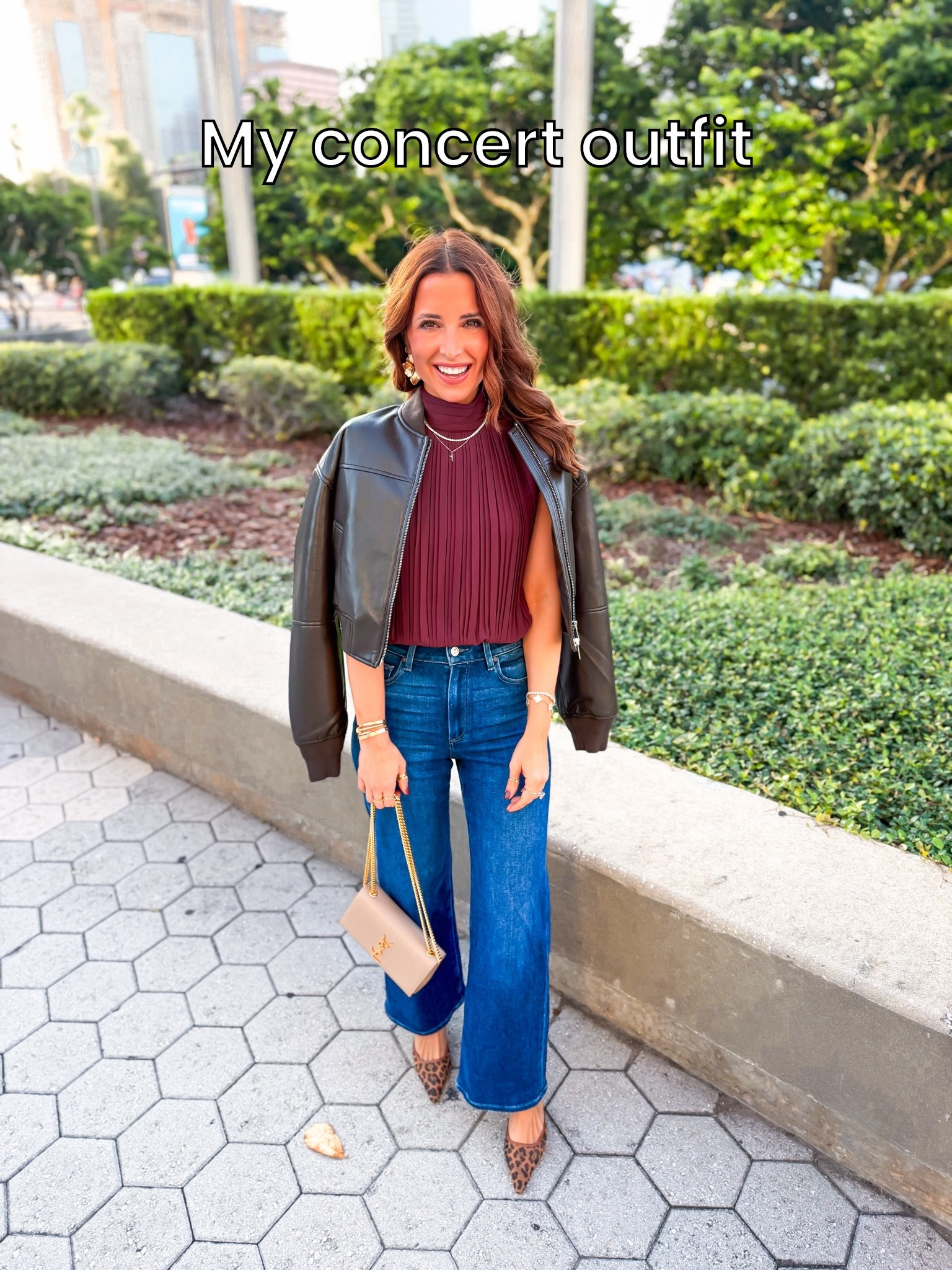 My concert outfit. Aritzia top in 2XS. Faux leather bomber jacket in 2XS. Paige wide leg jeans in 23 petite - this style runs a little big. Leopard heels are older. YSL purse. Date night outfit. Dinner outfit.