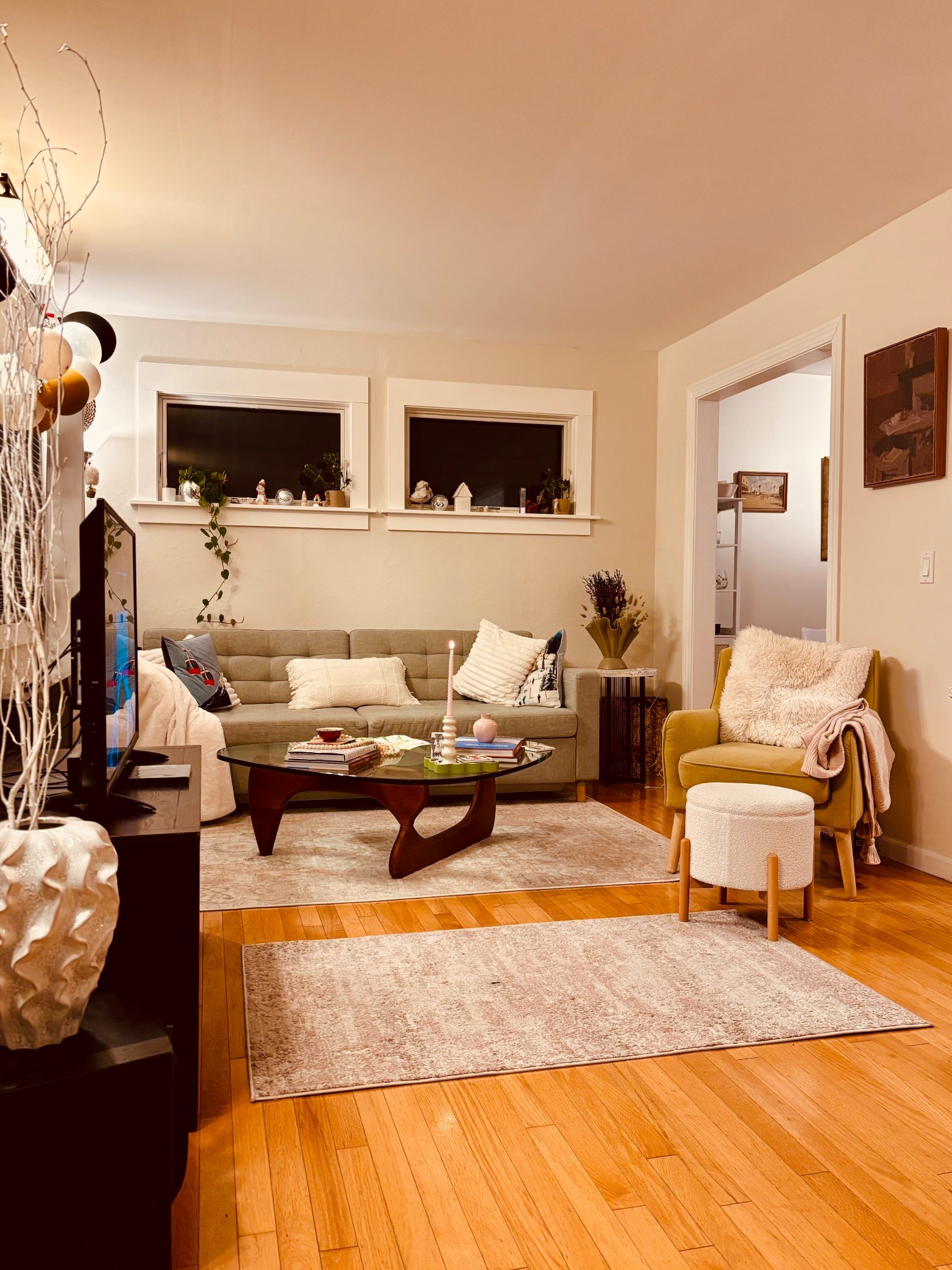 Evening living room view! This is the third time I rearrange the living room. IKEA sleeper sofa, Wayfair accent chair and Noguchi-style coffee table. Rugs from Wayfair. #livingroom #homedecor

#LTKHome #LTKSeasonal #LTKdayinmylife